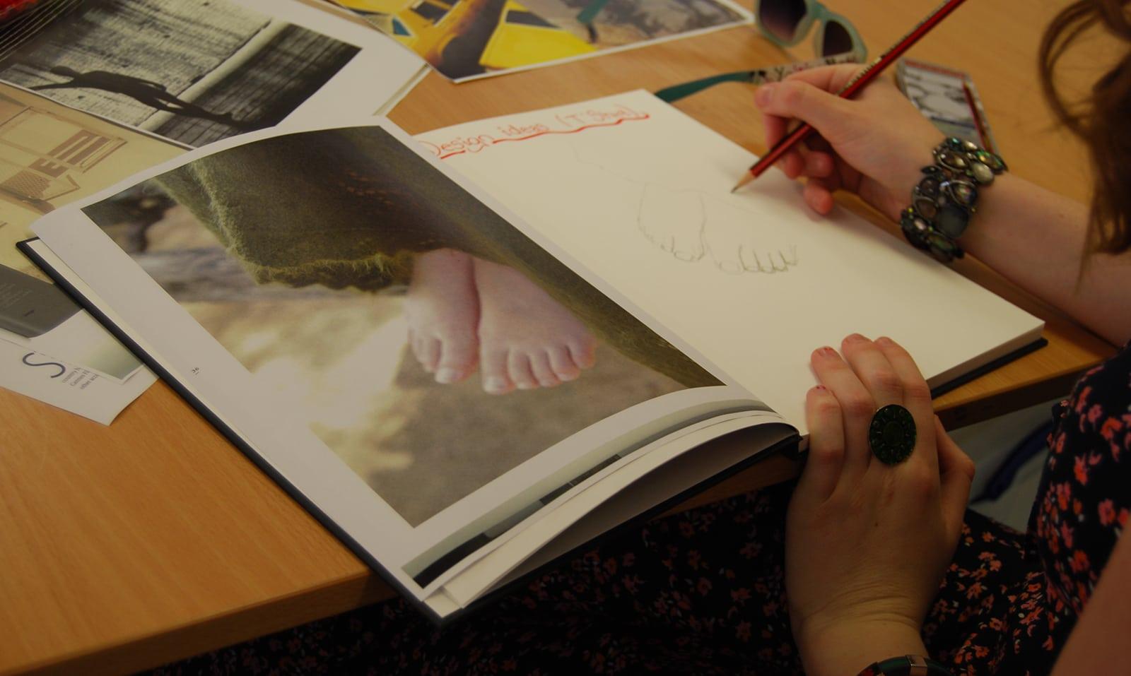 Student taking inspiration from a book