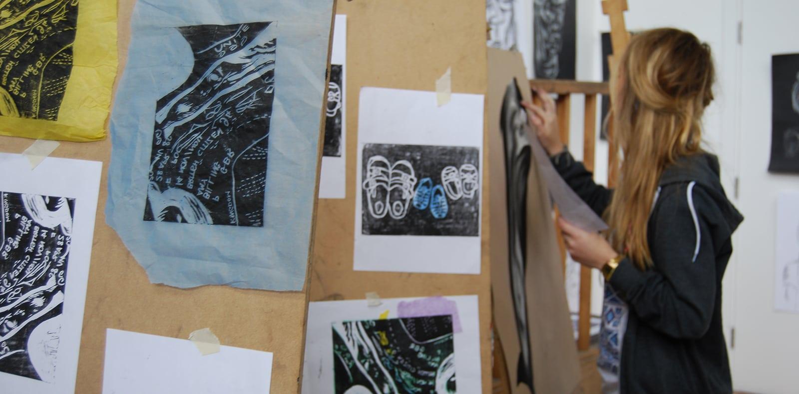 Student working on an easel