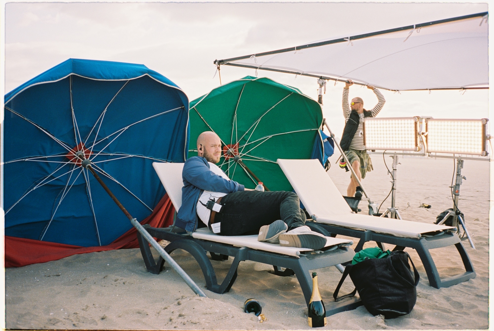 L T Skare on a sun lounger on location for "Sentimental Value" (2025)