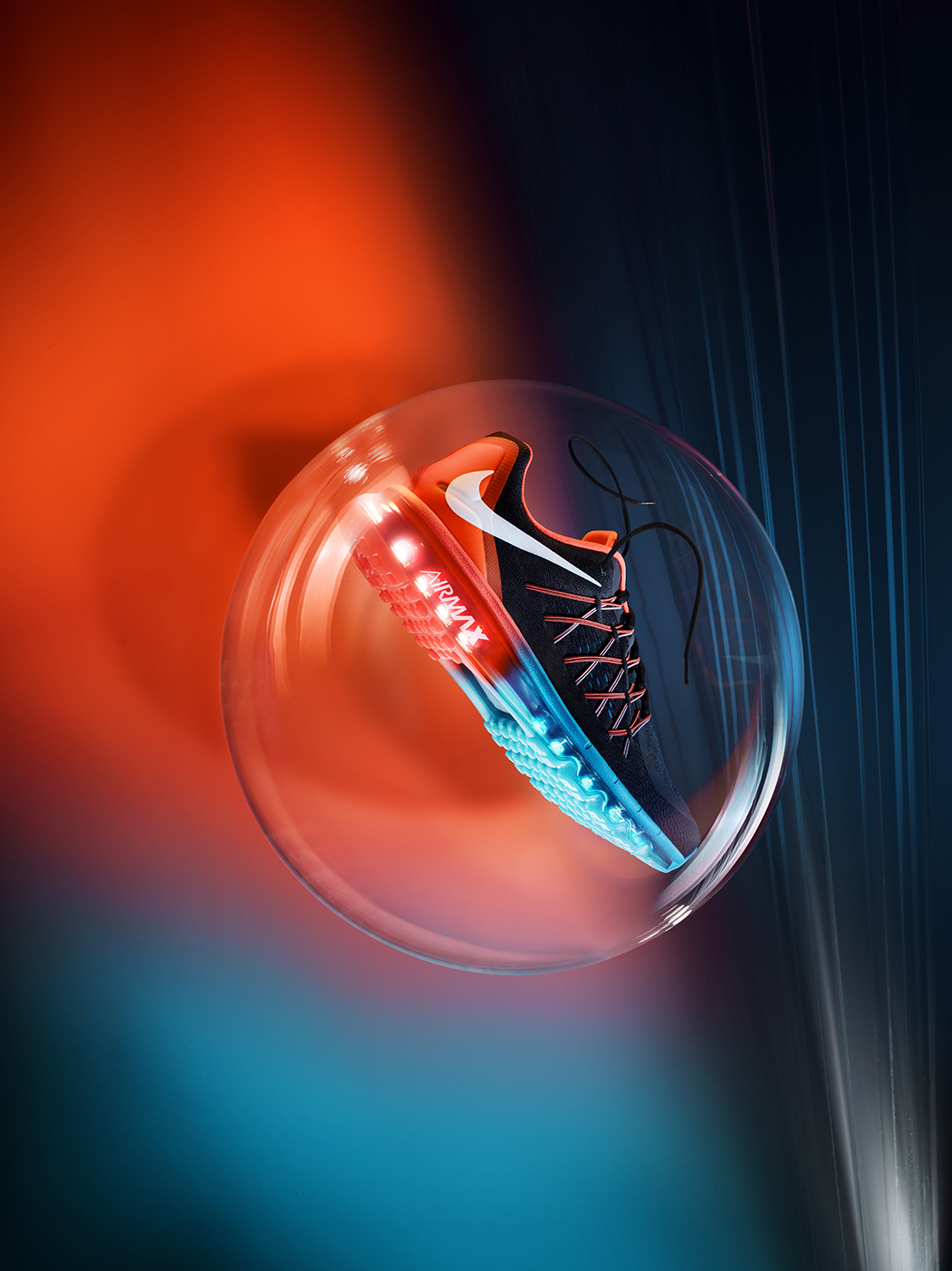 A Nike sneaker in a bubble with orange and blue lighting