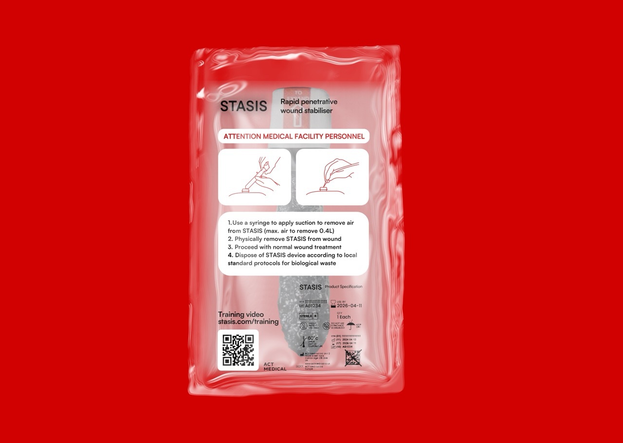 Back package for STATIS in clear plastic wrap, instructions with diagrams in white and red on the front, red background.