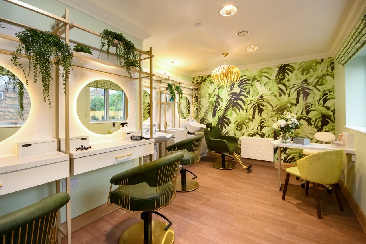 Salon area for Diana Celella's 'Wellford Gardens Care Home' with green floral design and wallpaper.