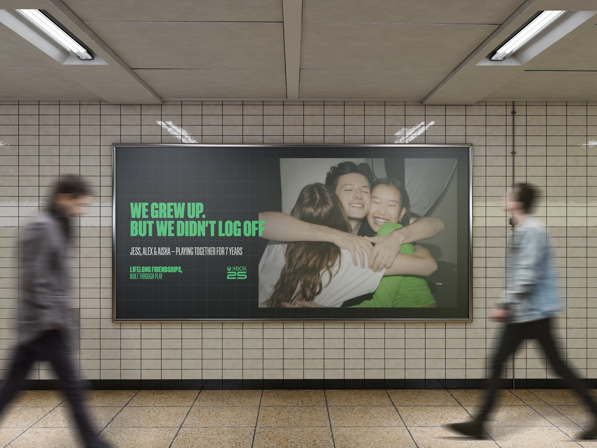 A large underground station poster shows three people hugging beside the slogan 'WE GREW UP, BUT WE DIDN'T LOG OFF', with tiled walls and blurred commuters passing in front.