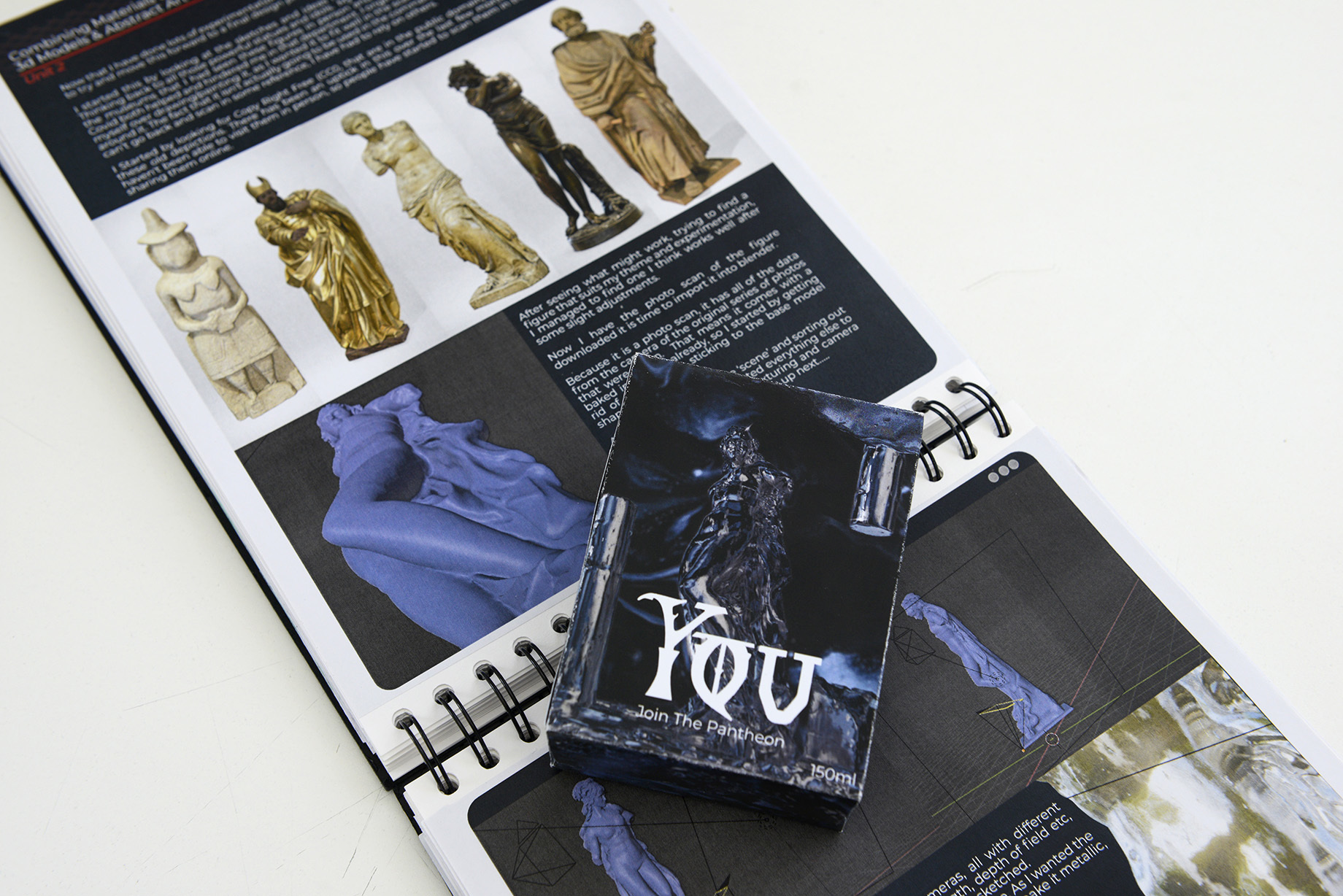 Packaging box for a product called 'You', lying on top of an open portfolio book.
