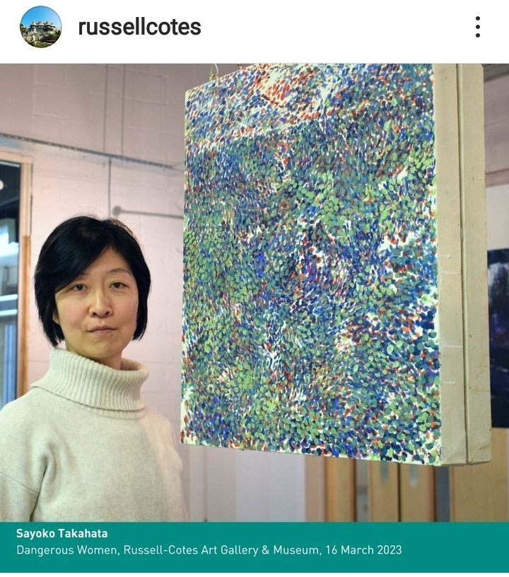 Instagram post showing artist S Takahata standing next to an abstract piece of art.