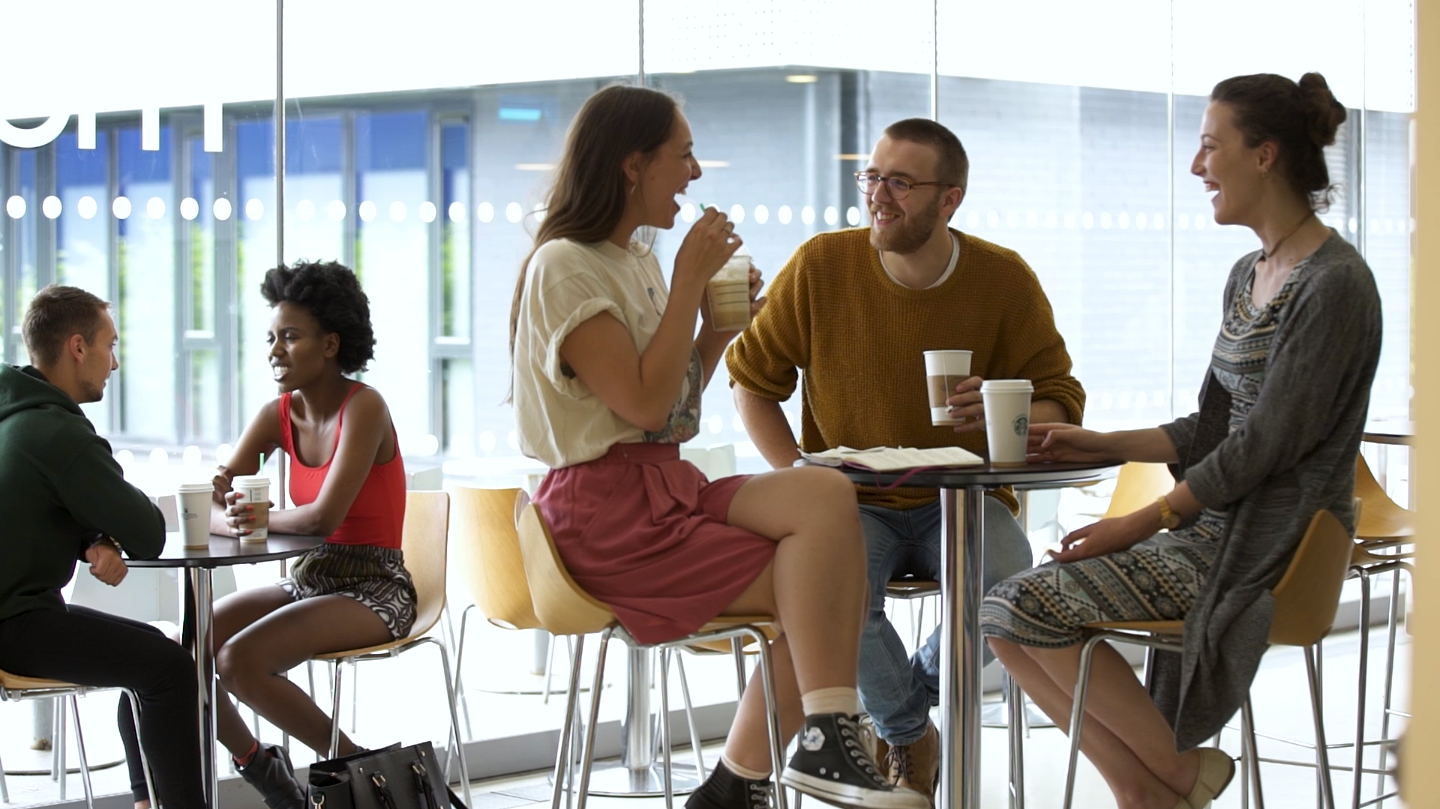 Student enjoying coffee at the Starbuck on AUB Campus