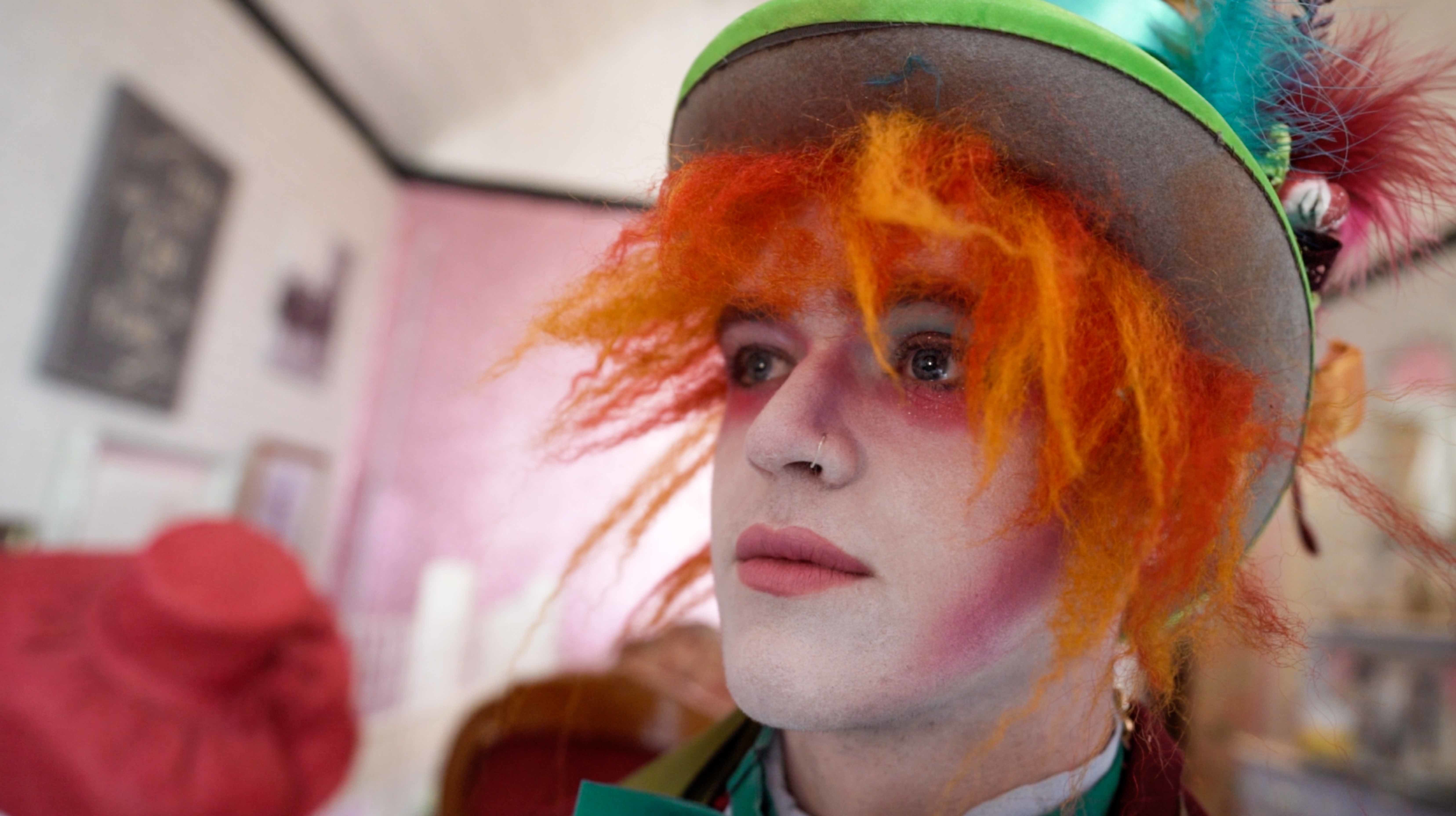 An AUB Acting student dresses as the Mad Hatter for an Alice in Wonderland themed event