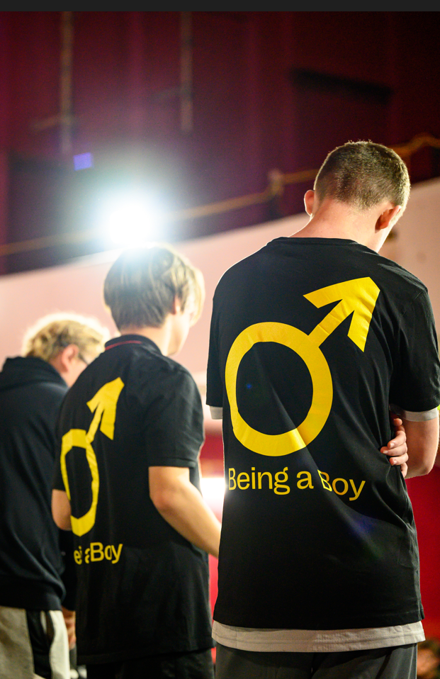 Being a Boy participants on stage at Palace Court theatre looking out to the audience
