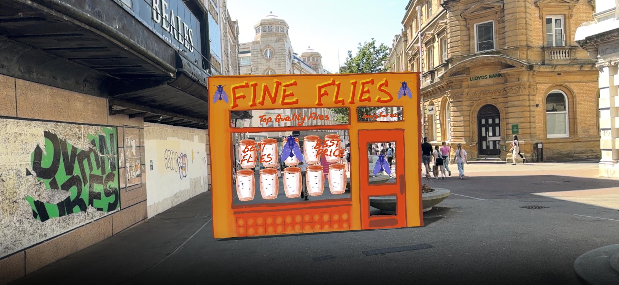 An orange Fine Flies kiosk with illustrated posters and product displays stands in an open city square, beside historic stone buildings and a covered walkway.