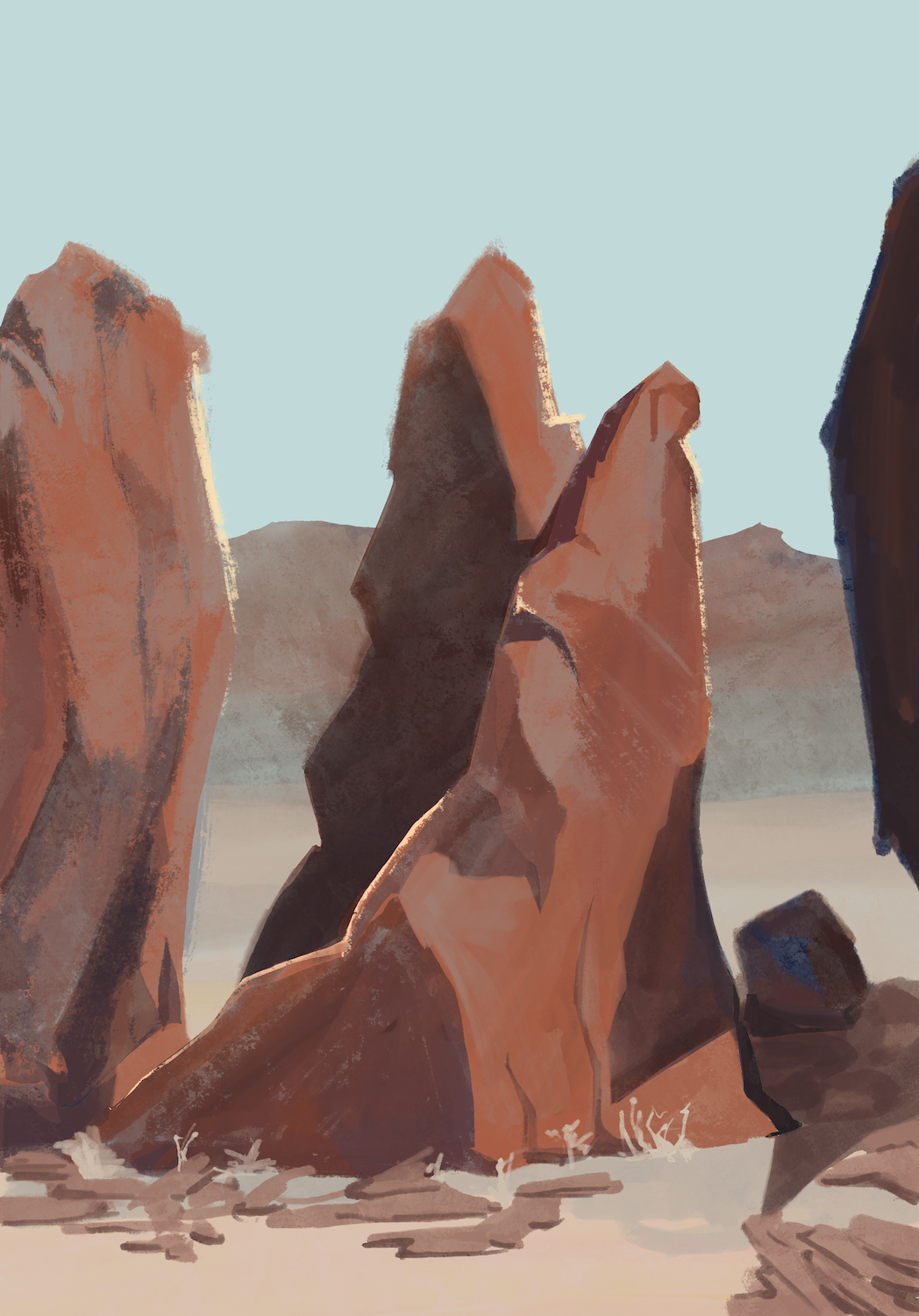 Three large jagged rocks in a desert scene.