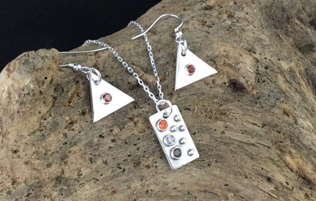 Silver pendant with two earrings