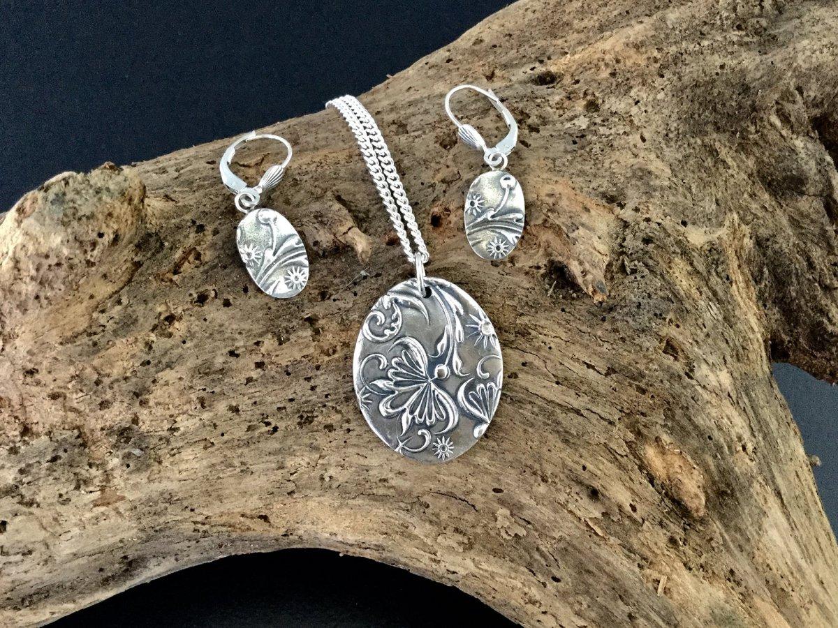Silver pendant with two earrings