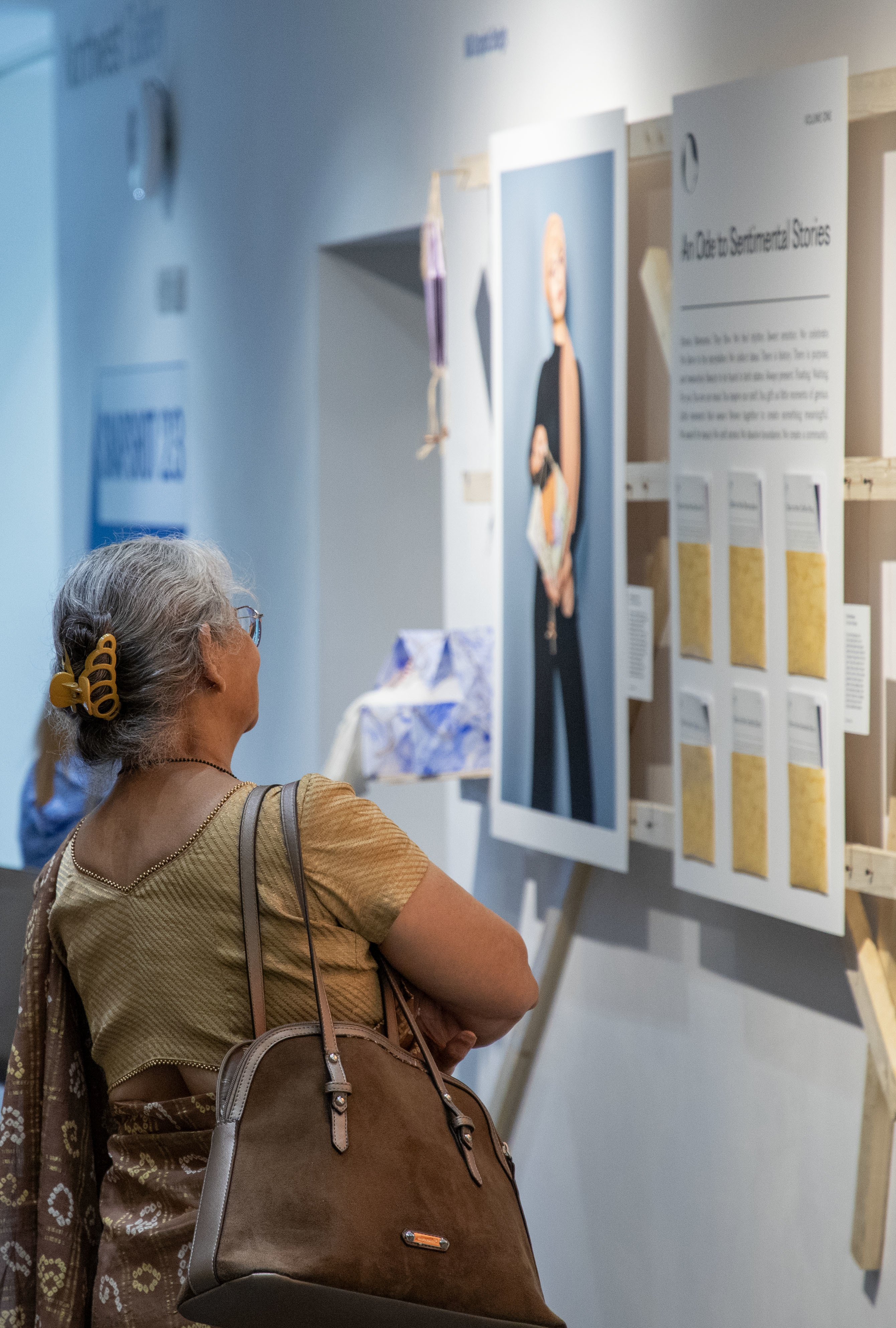 A person looks at artwork on display at TheGallery during the 2023 Snapshot shows.