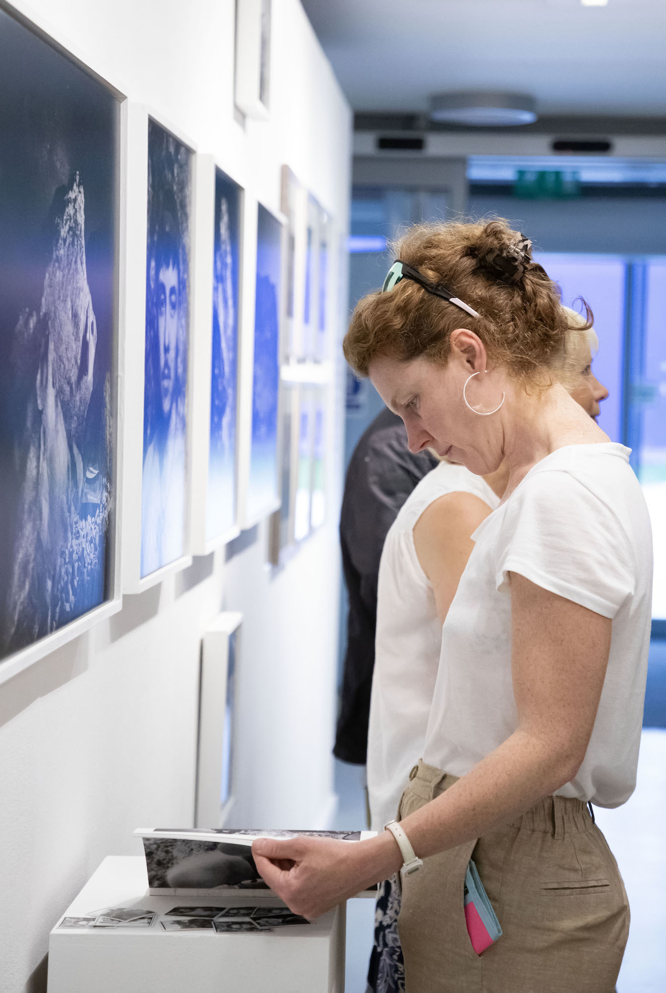 A person examining an exhibit at TheGallery during the 2023 Snapshot shows.