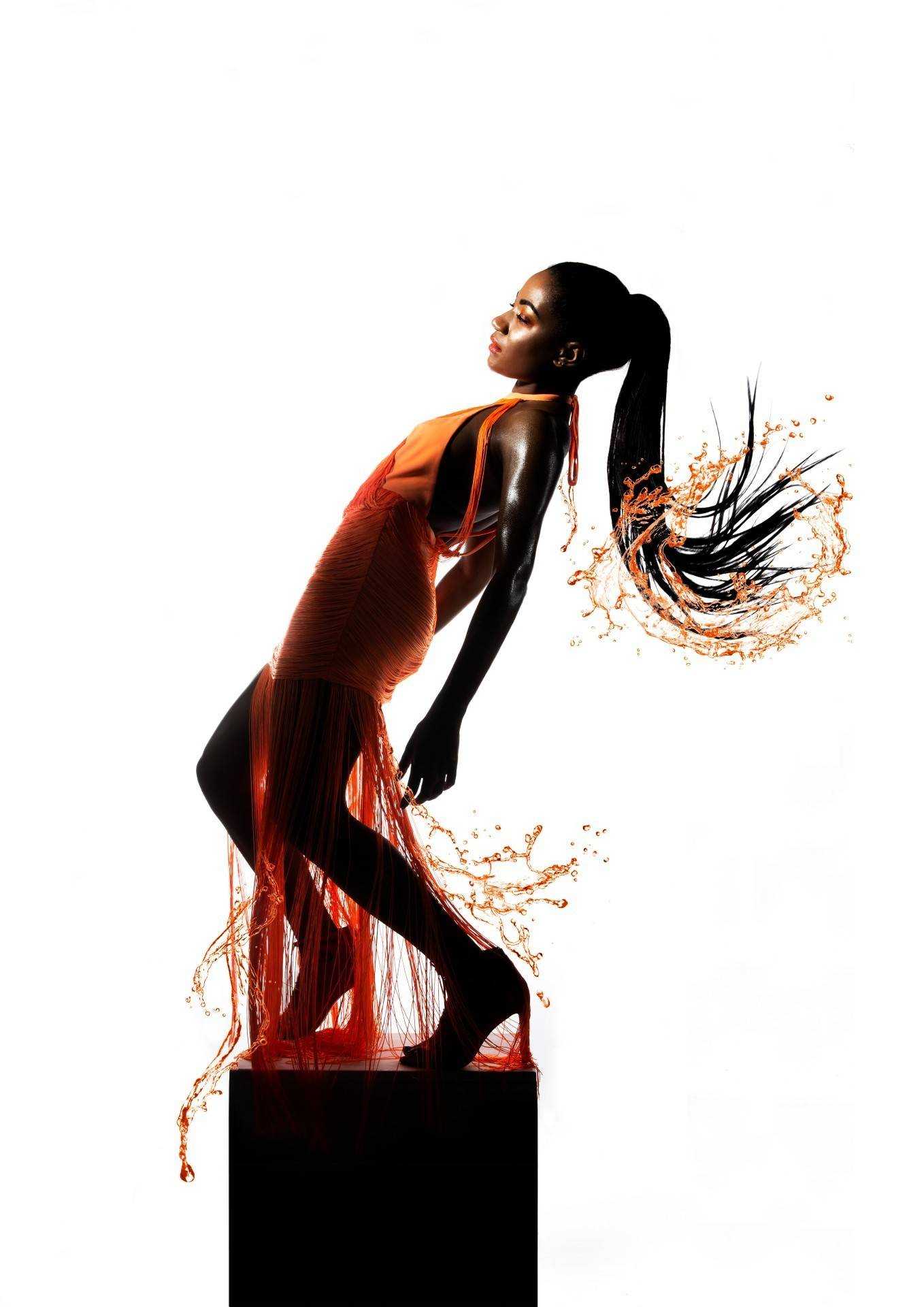 Model standing on a pedestal and leaning backwards.