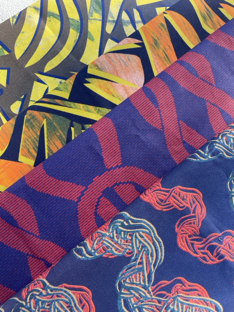 Collection of colourful patterned fabrics.