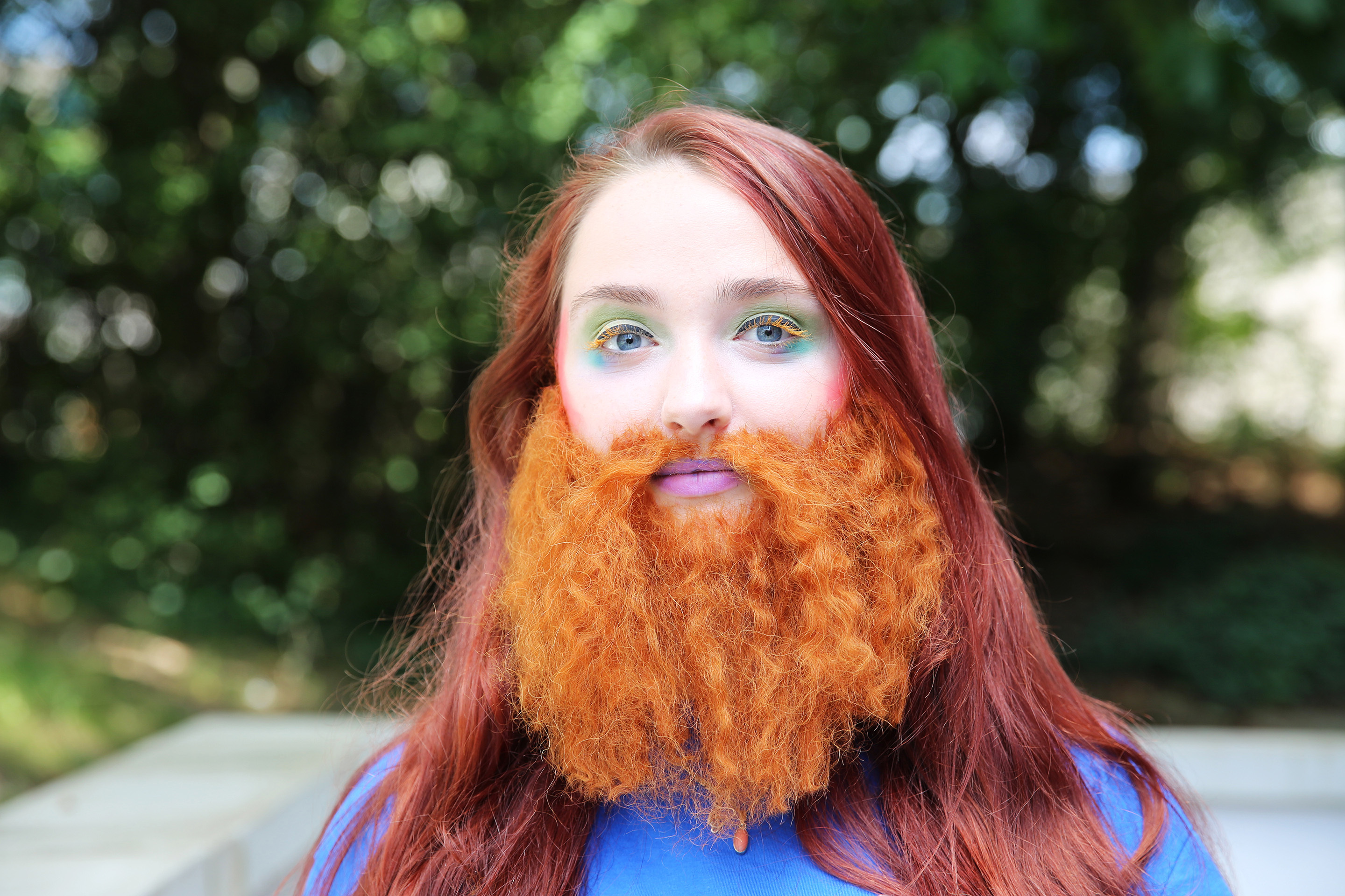 A student models a thick wavy beard