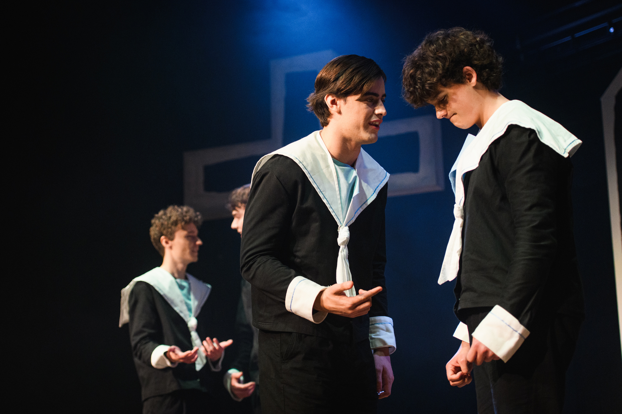 Two BA (Hons) Acting students in costume during a dress rehearsal of "Spring Awakening". Two other Acting students appear in the background.