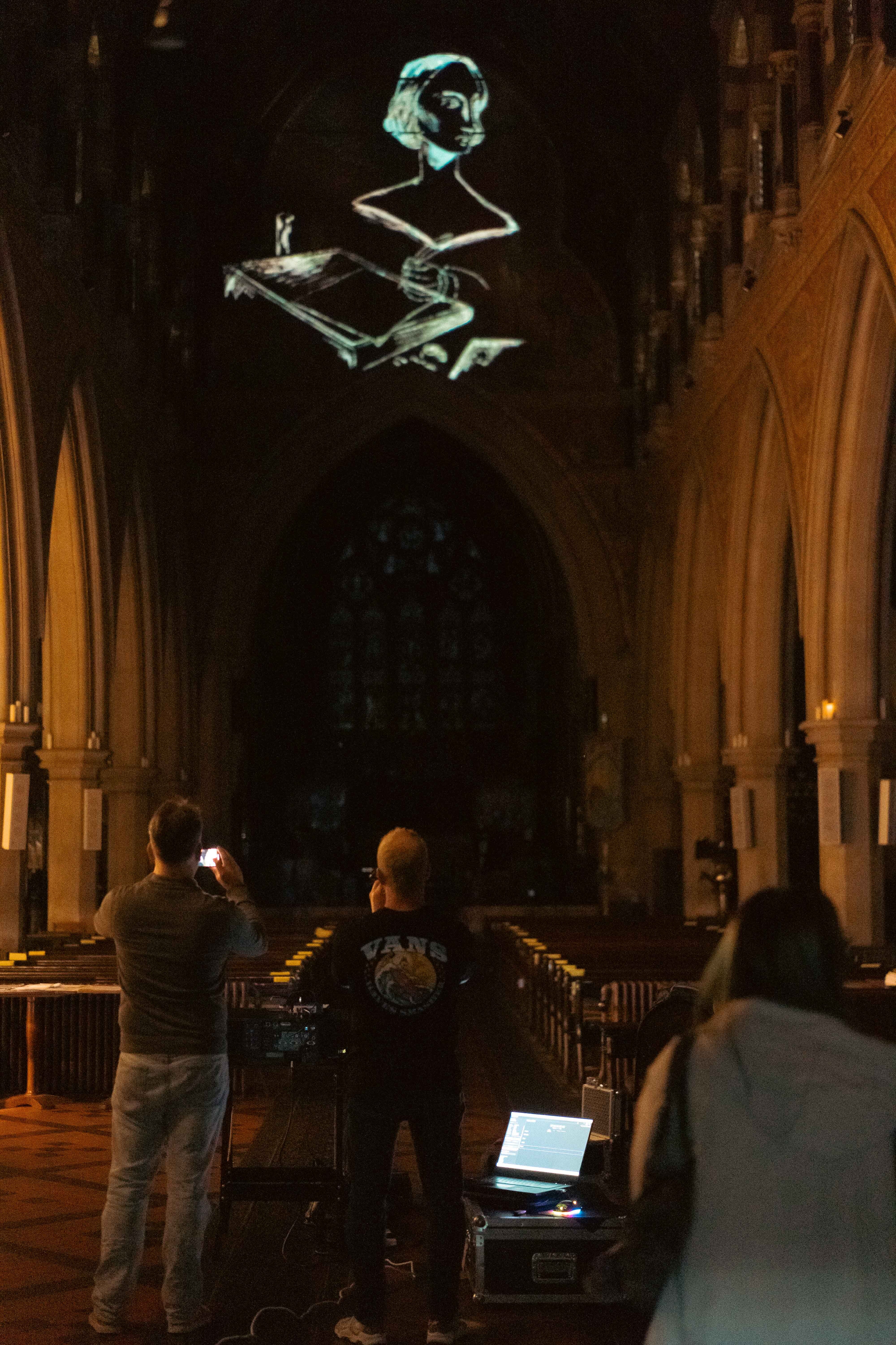 Test animation of Mary Shelley and a book projected onto the ceiling of St Peter's Church.