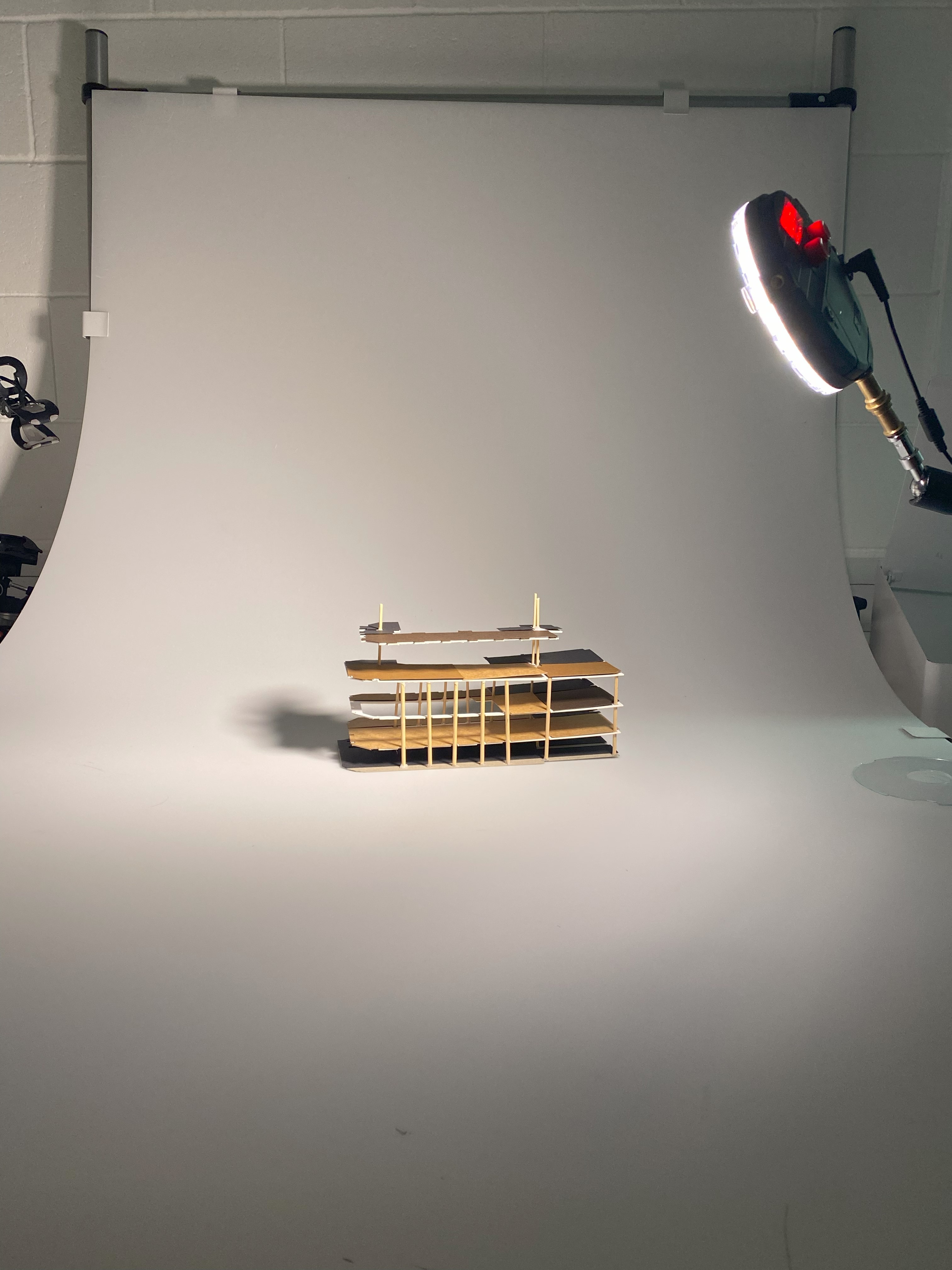Final Portfolio project, structural model with initial zoning testing in a photography studio, white background.