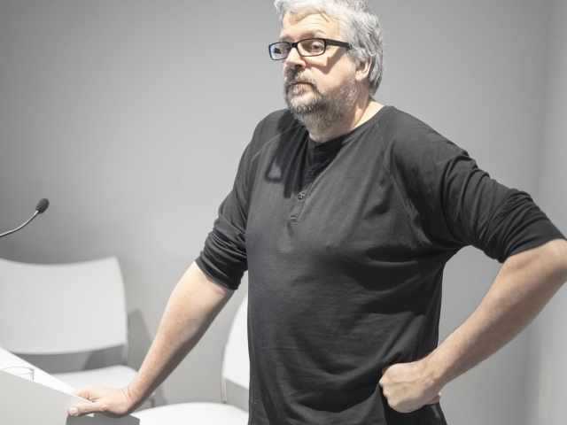 S Chomet delivers a lecture