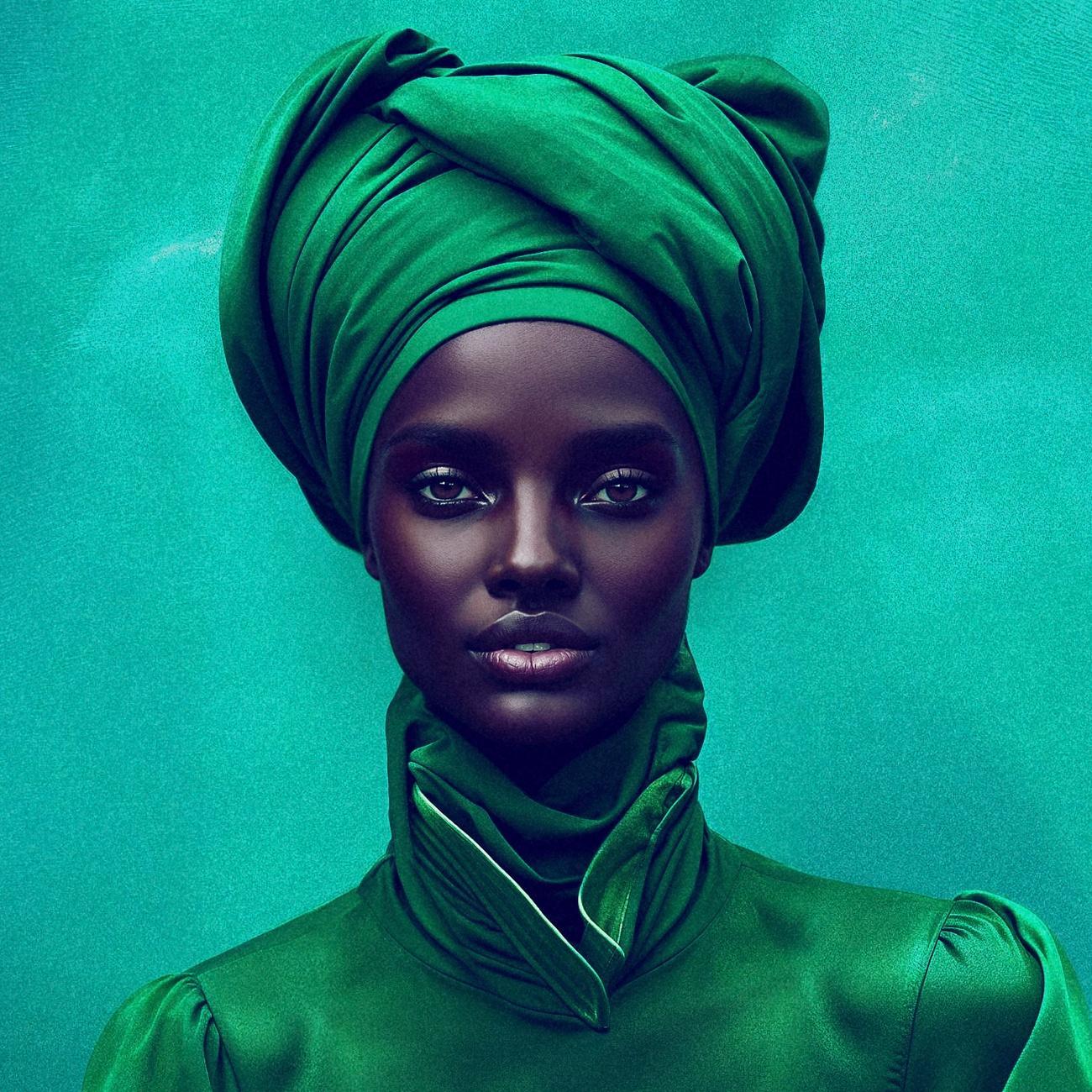 Close-up of a digital fashion model wearing a bright green jacket and turban.