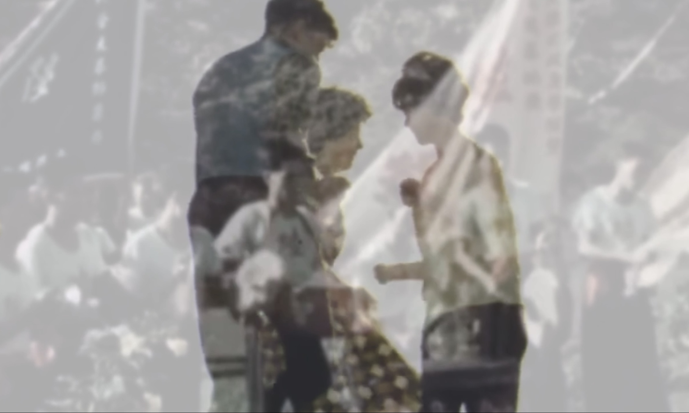 Still shot from RECOMMENDED DOSAGE showing overlayed silhouettes of people.