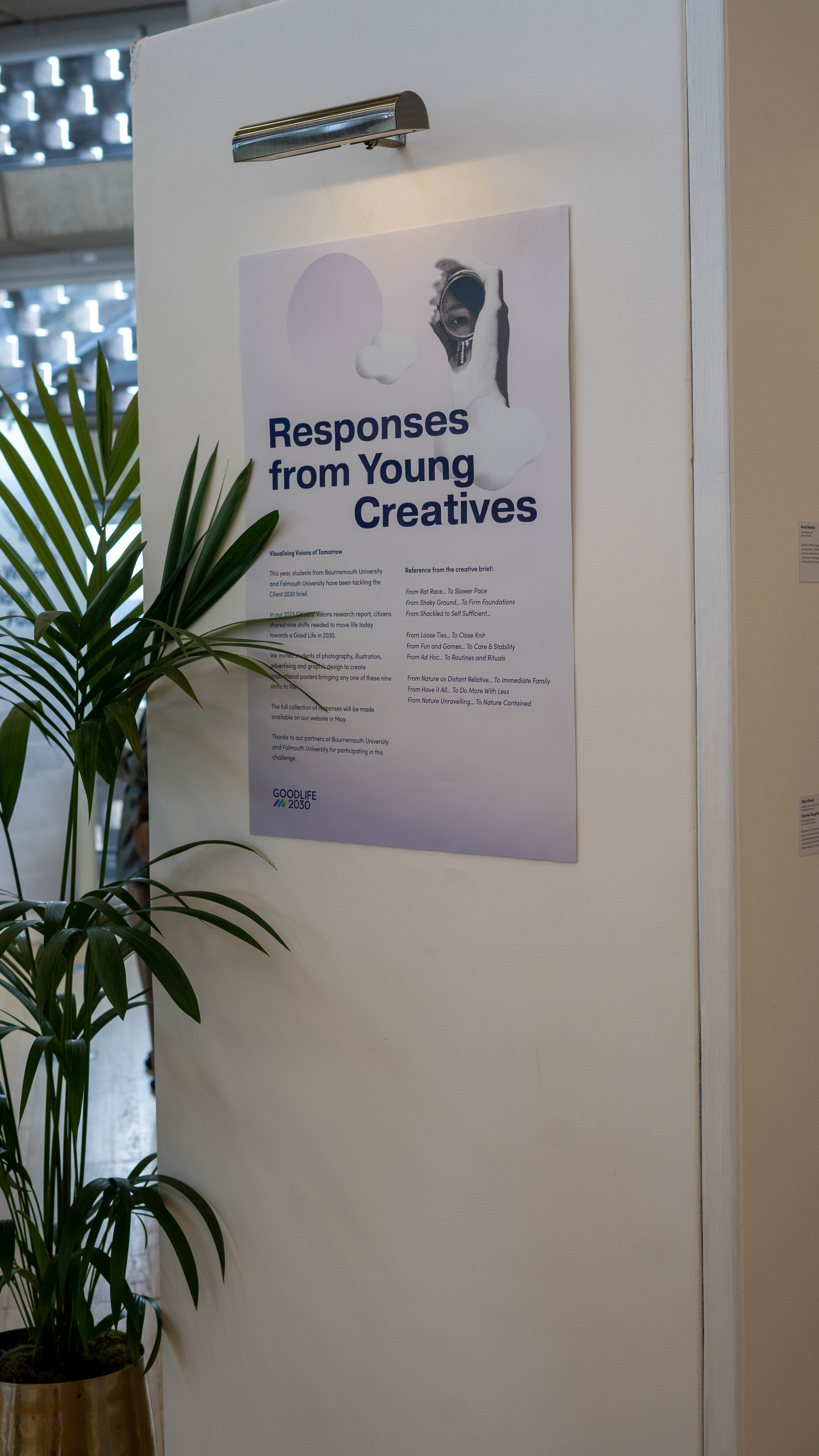 A poster entitled "Responses from Young Creatives" displayed on a gallery wall.
