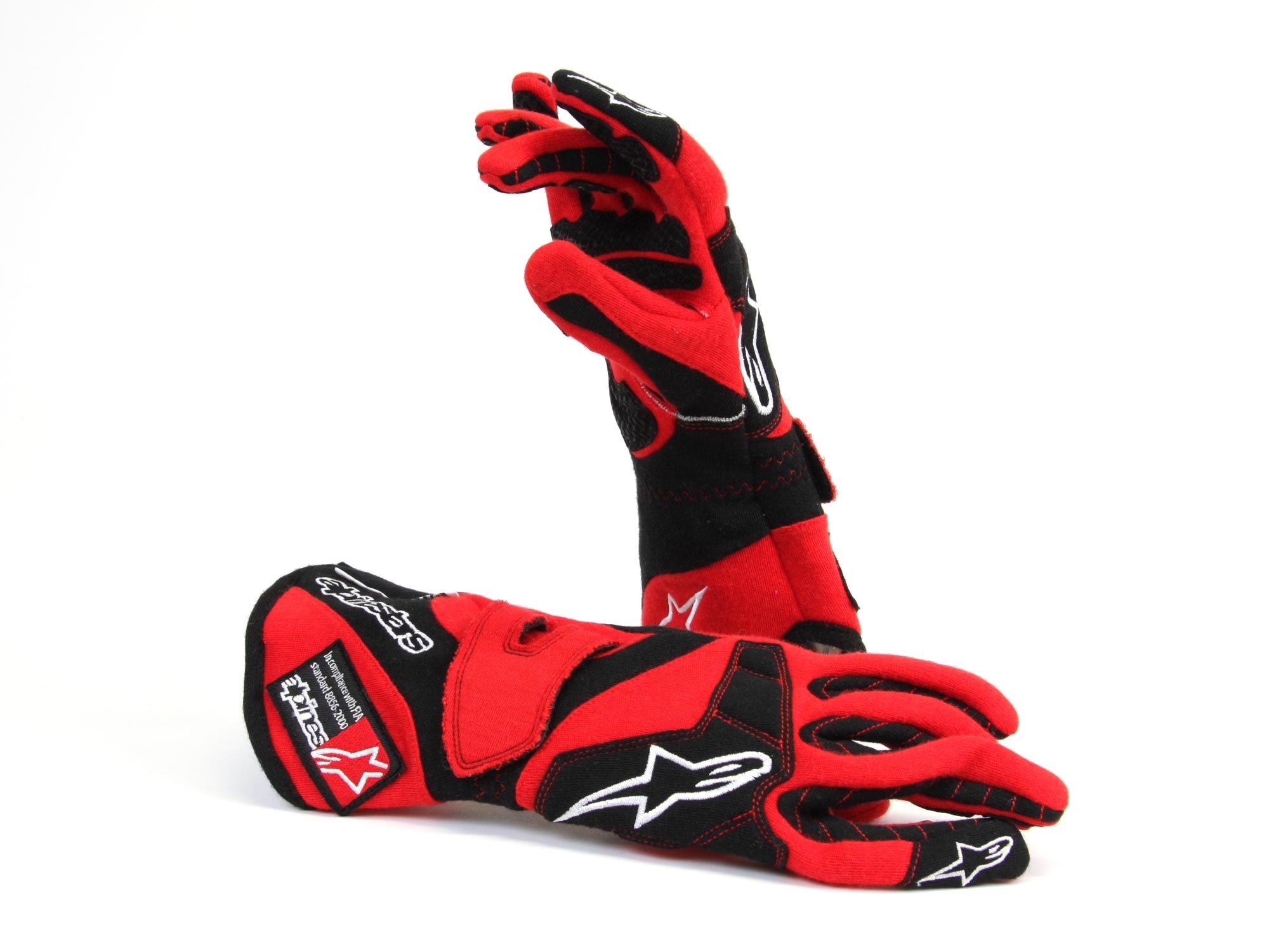 Image of red car/motorbike racing gloves designed by Alpinestars