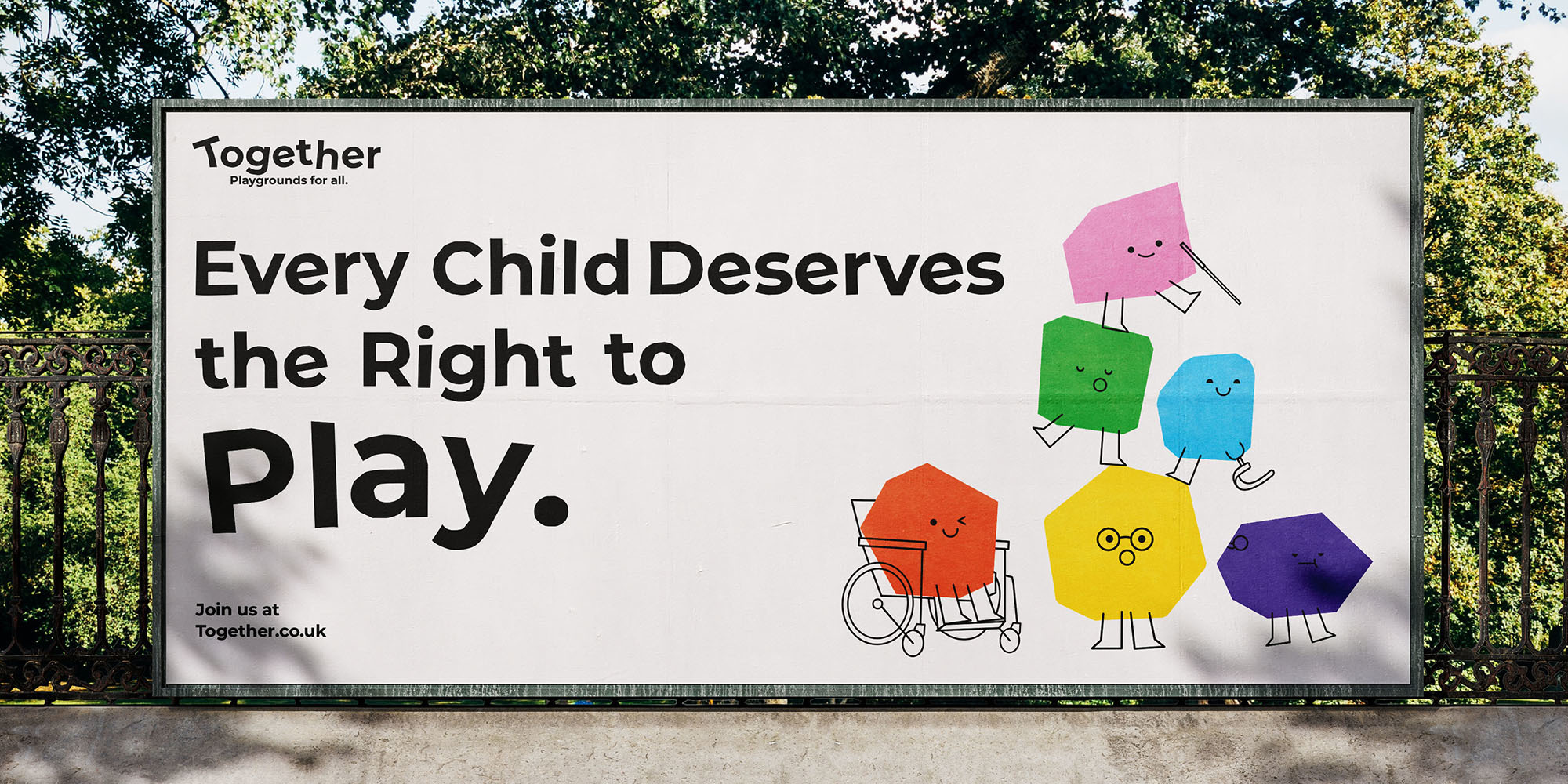 Billboard with text saying, “Every Child Deserves the Right to Play.” along with colourful characters representing non-disabled and disabled children.