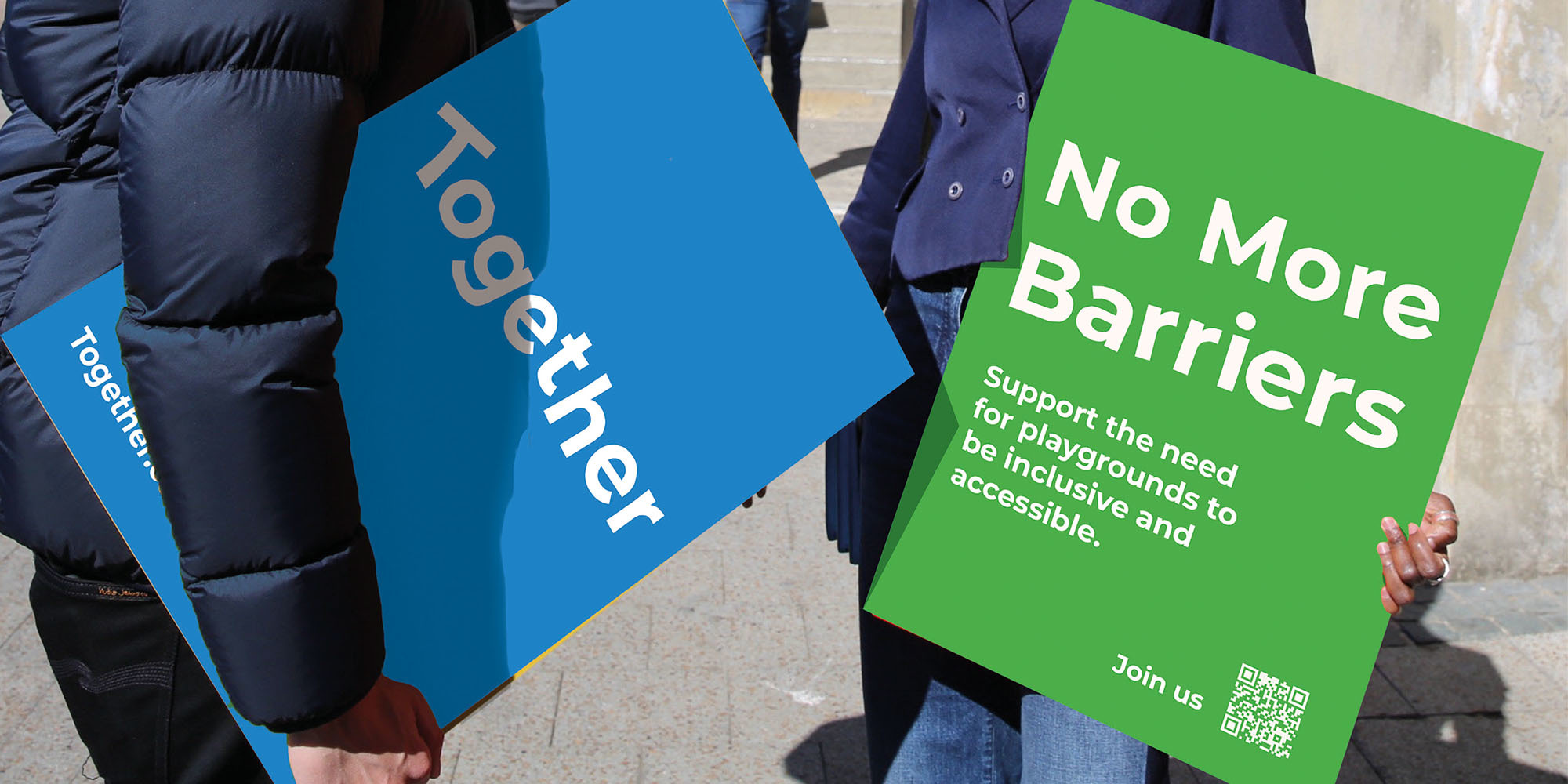 One blue protest sign with the campaign's brand name “Together” and one green protest sign which says, “No More Barriers” with small text that asks individuals to join the campaign.