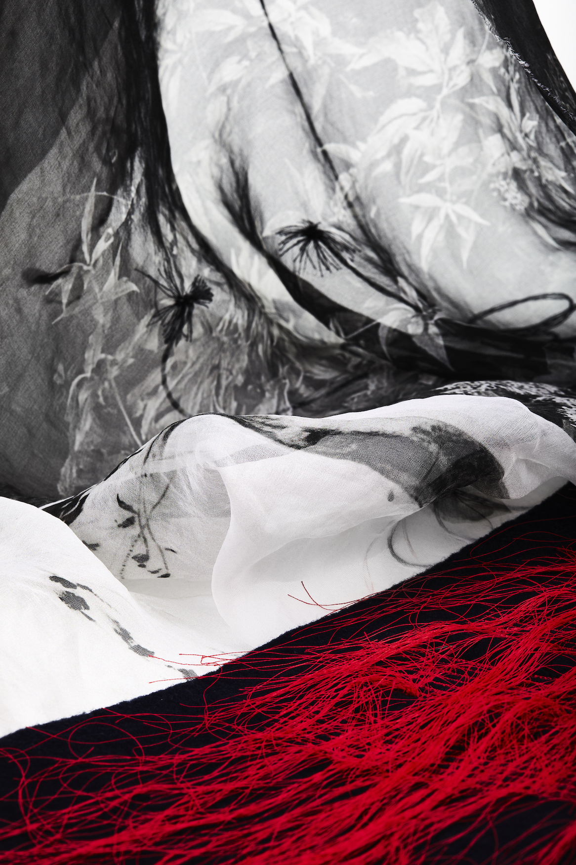 Red, white and black floral textile layers.