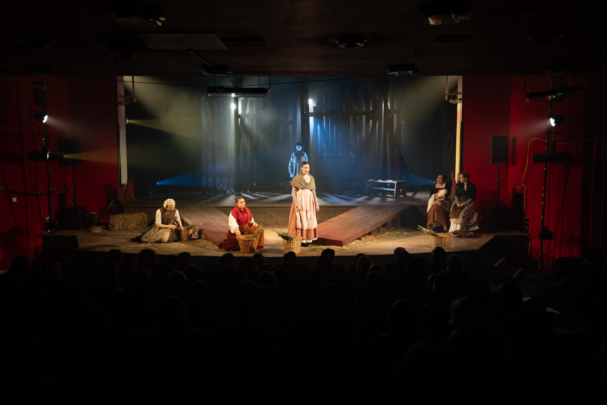 AUB Productions' 'The Ballad of Maria Marten' – actors on stage in period costume with wheat in baskets.