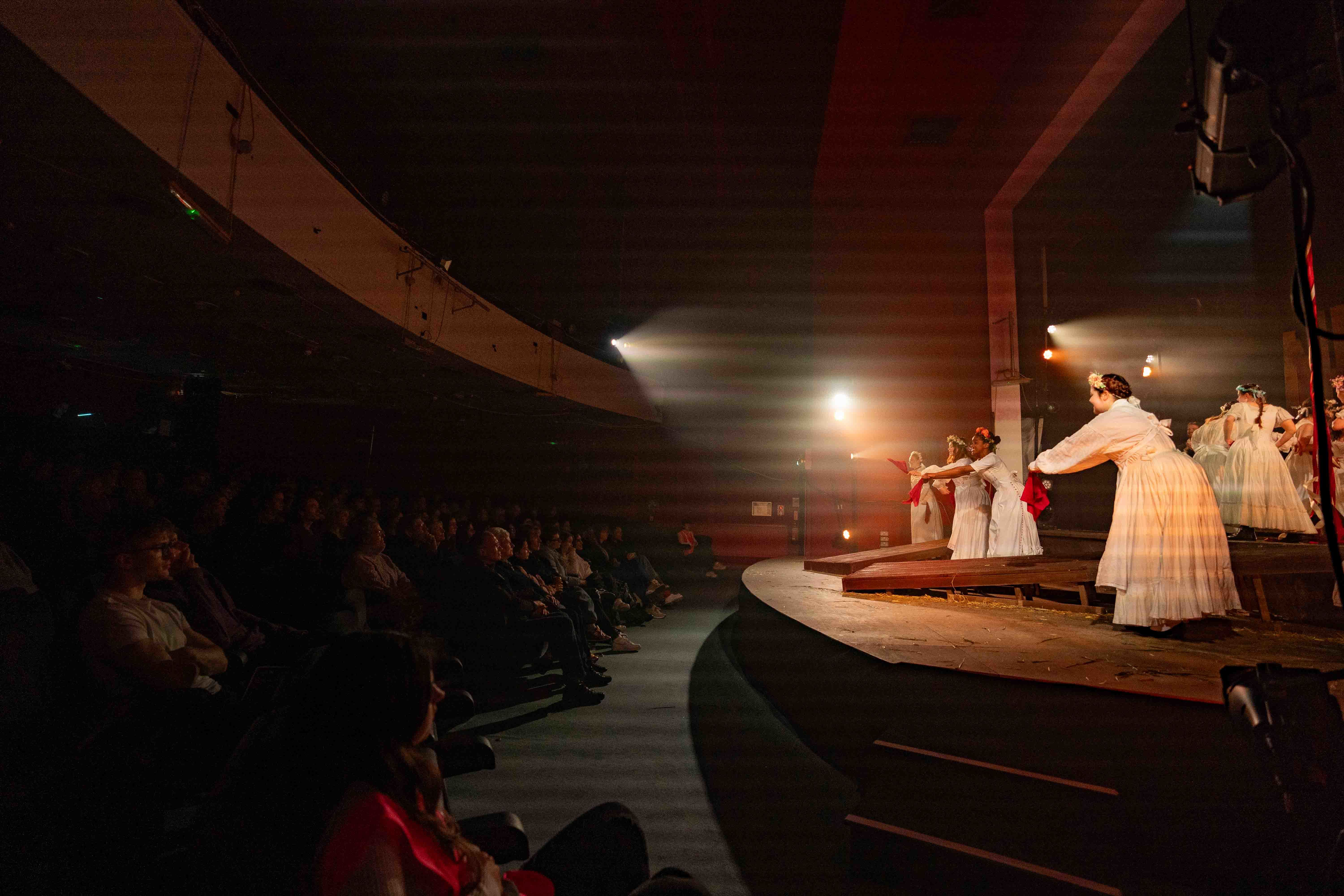 An audience watches as a group of BA (Hons) Acting students perform a production of "The Ballad of Maria Marten" at the Palace Court Theatre in Bournemouth.