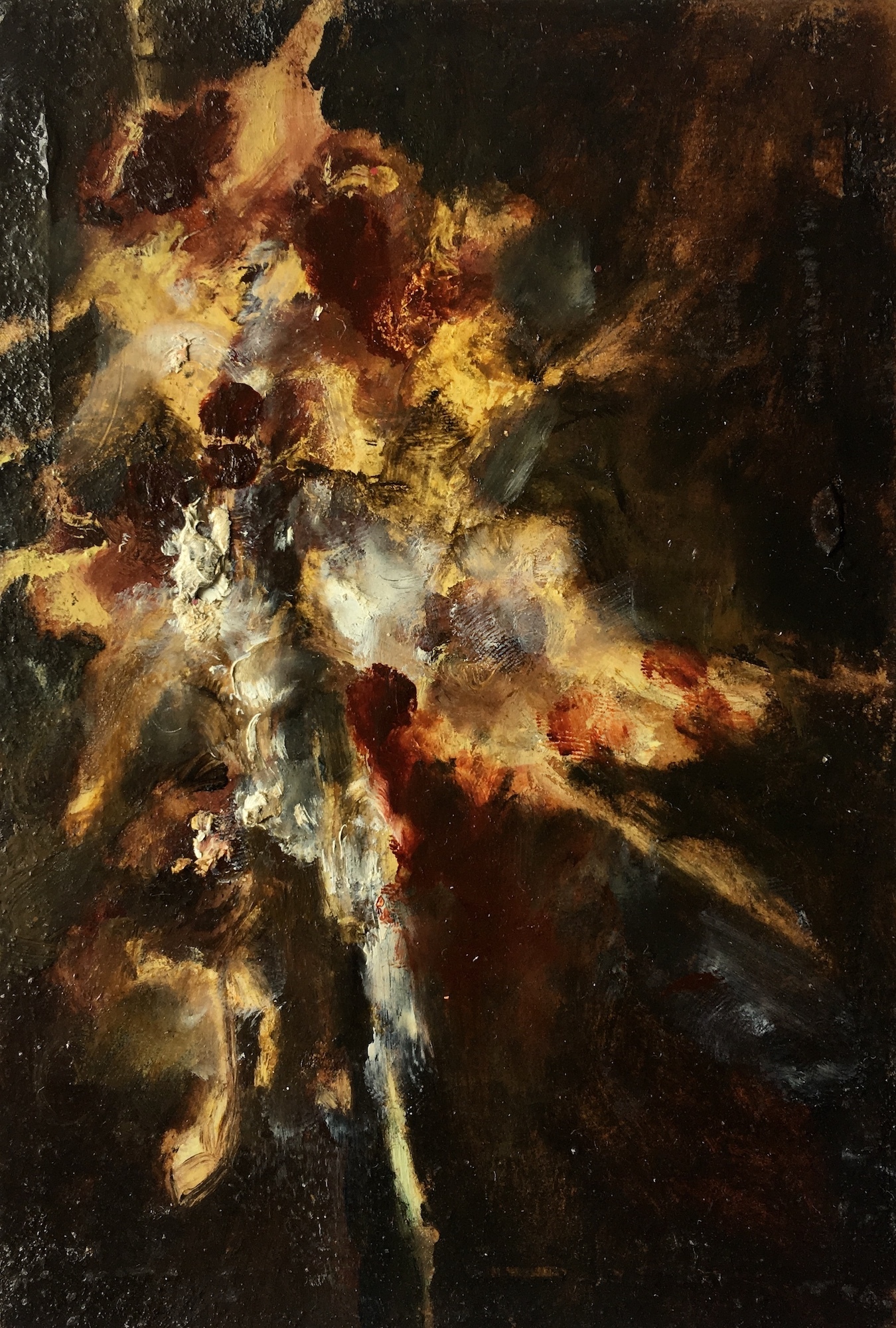 Abstract image of an explosion of yellow, brown and grey in a dark backdrop.