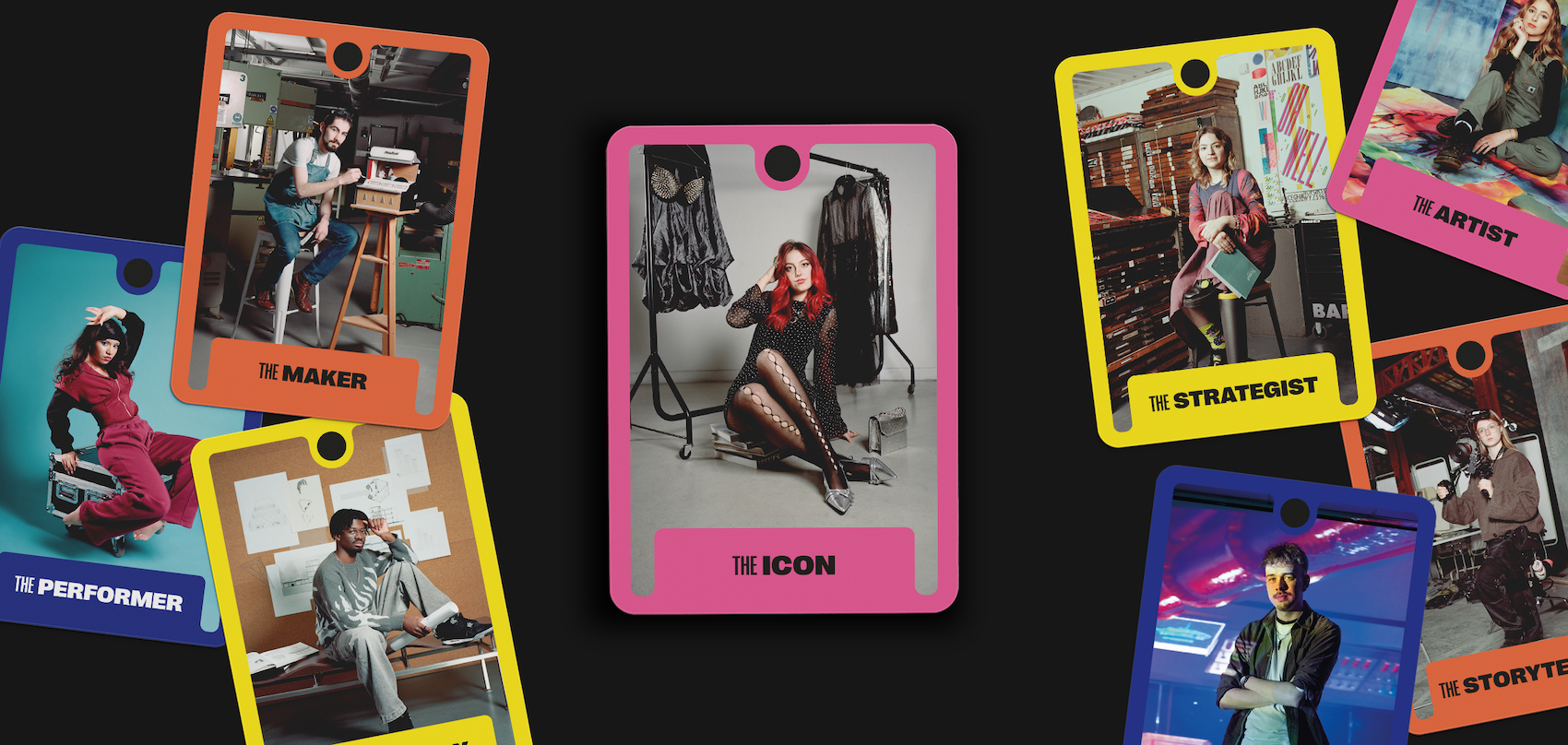 Colourful trading cards scattered on dark surface featuring people in various poses. Cards have bright borders in orange, pink, yellow, and blue with text labels at bottom.
