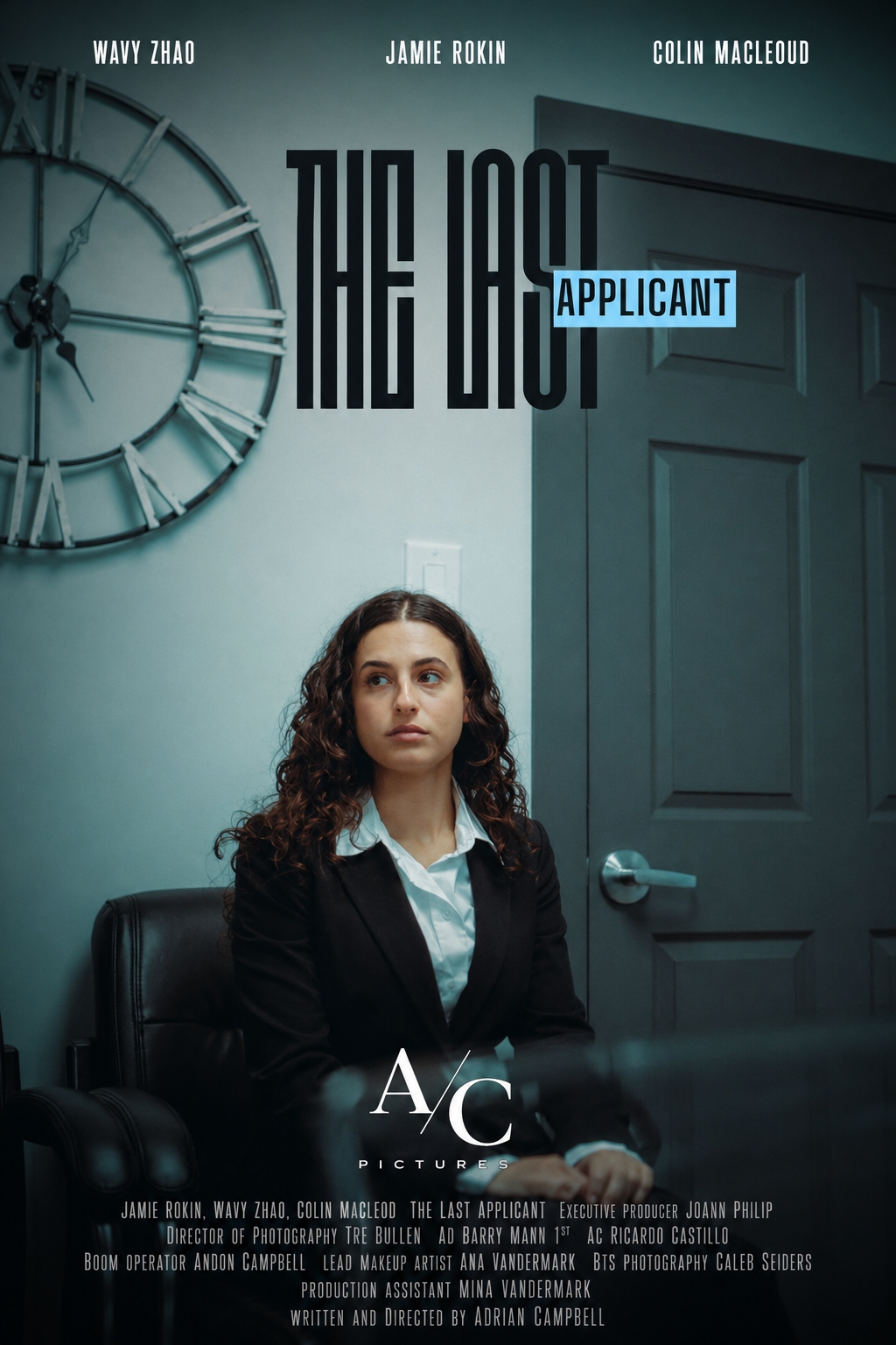 A woman in a black blazer sits in an office chair beneath the title text ‘The Last Applicant’, with a wall clock and a closed door in the background.