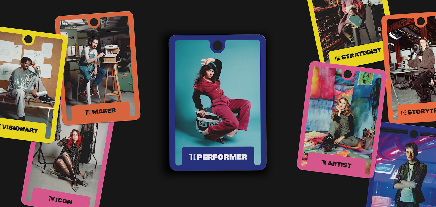 Six colourful tarot-style cards scattered on dark surface. Centre card shows person in red outfit on teal background, labelled "Performer".