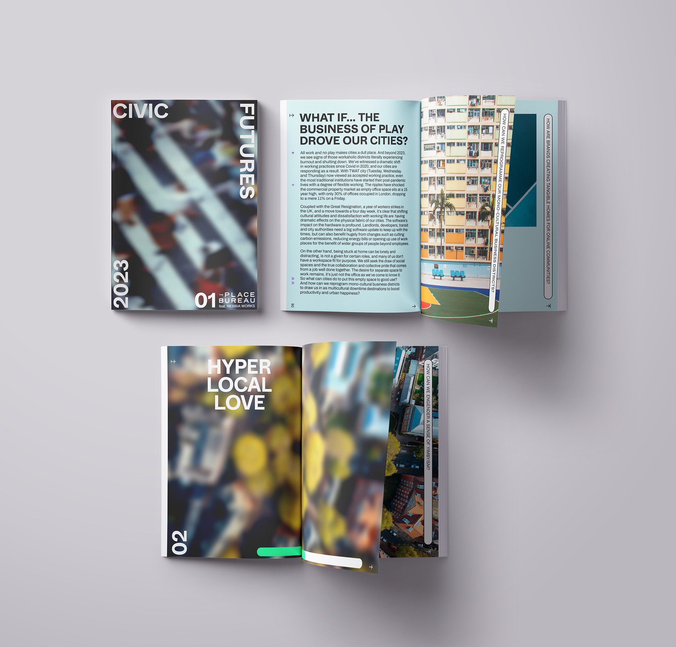Three books are open on a desk