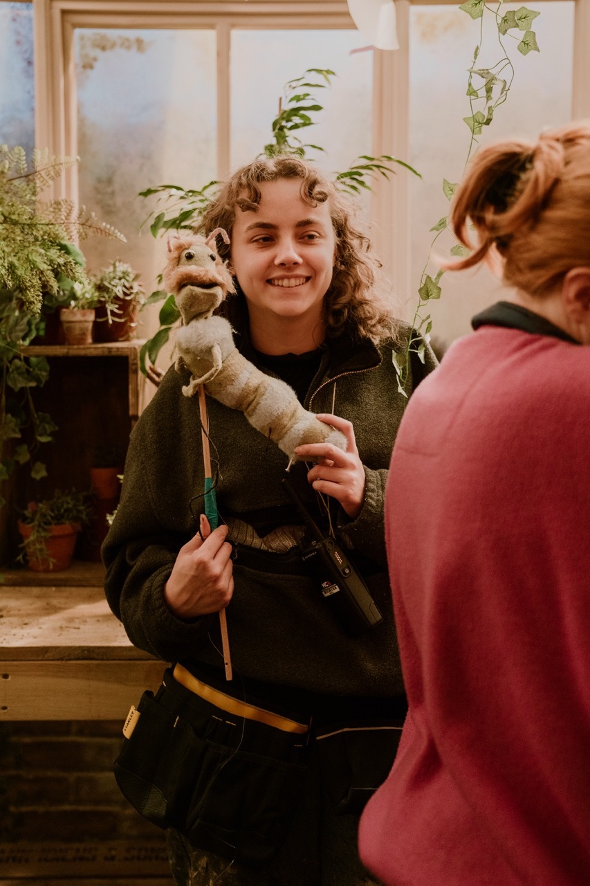 BTS shot from 'The Greenhouse Next Door' showing Alison Tierney with the Fred puppet.
