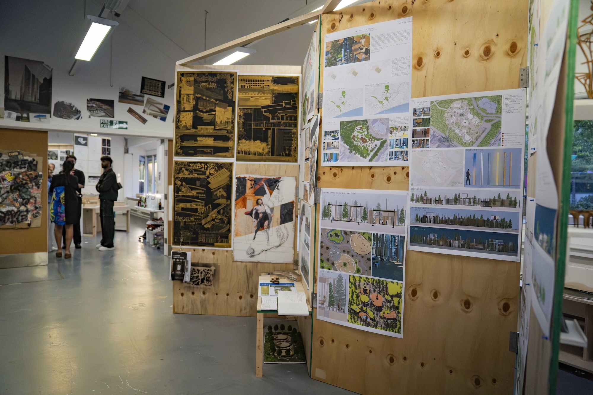 A series of architectural designs and drawings on display on wooden boards, at the 2024 Undergraduate Summer Shows at Arts University Bournemouth.