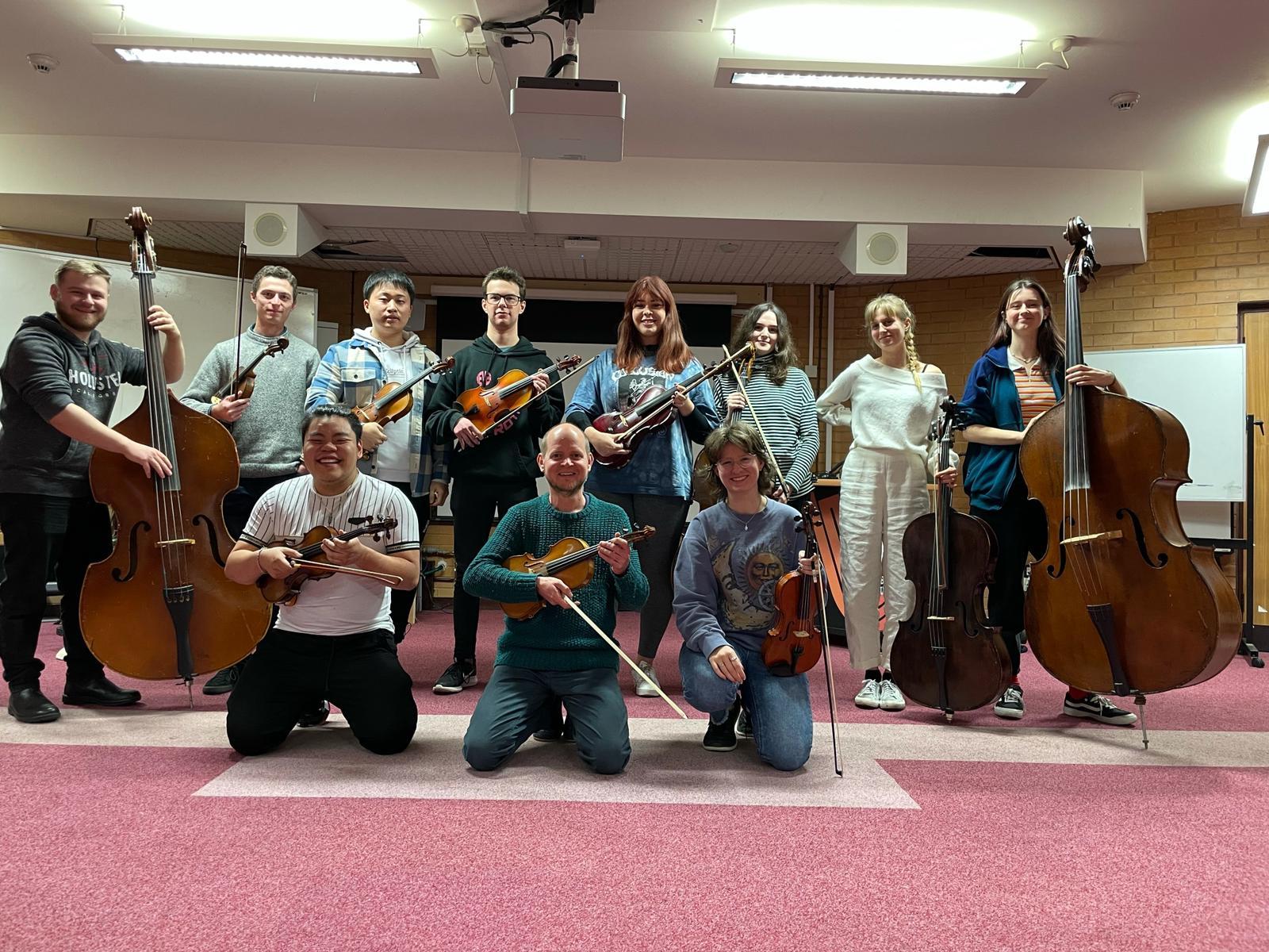 University Music string ensemble group posing