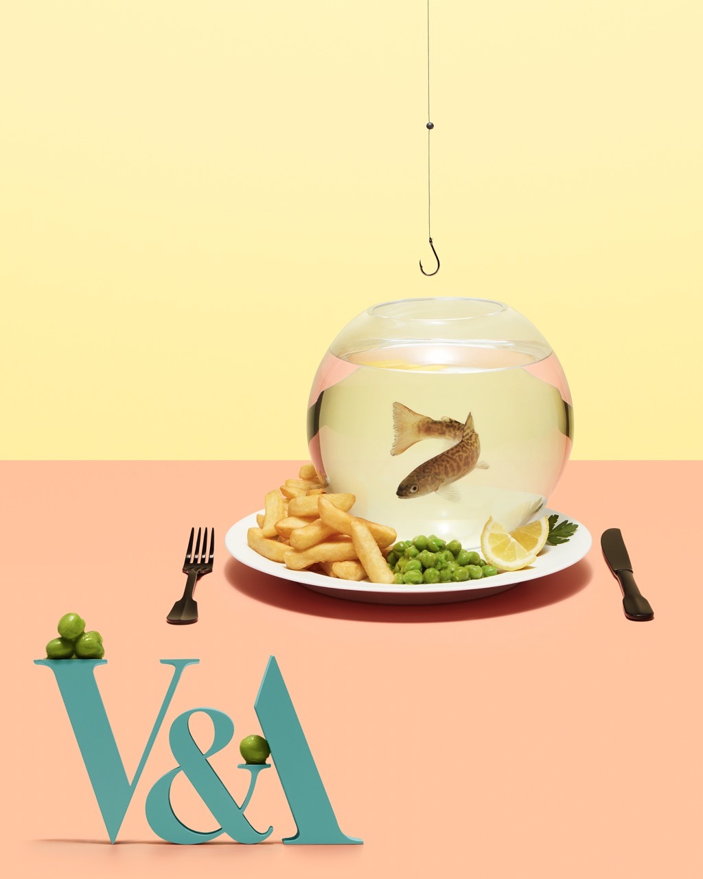 A plate of chips and peas with a fishbowl and the V&A logo.