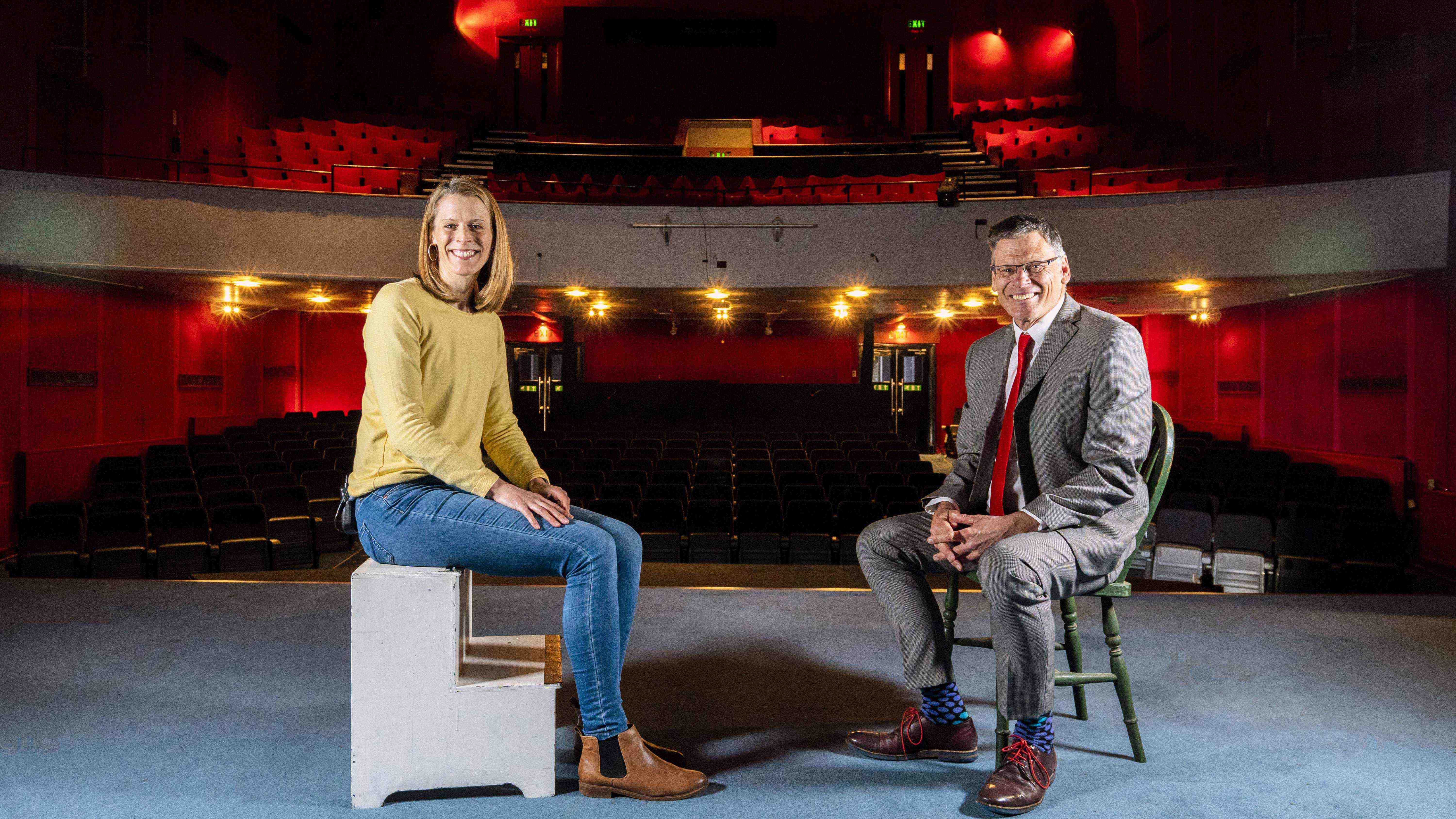 Acting Course Leader Katharine Piercey with Vice Chancellor Professor Paul Gough sit opposite one another on stage at the Palace Court Theatre, Bournemouth