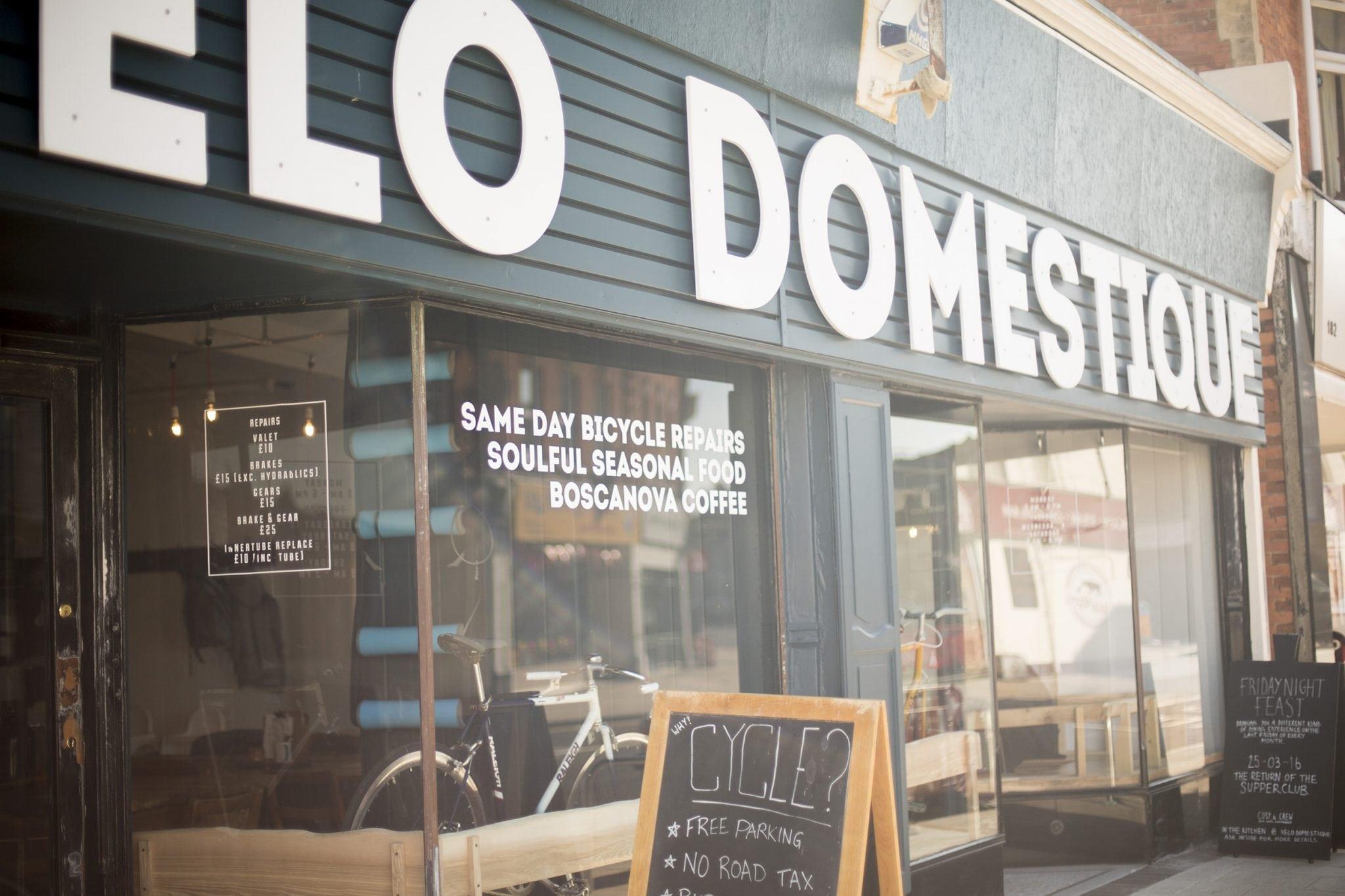 External shot of local cafe and bike repair shop