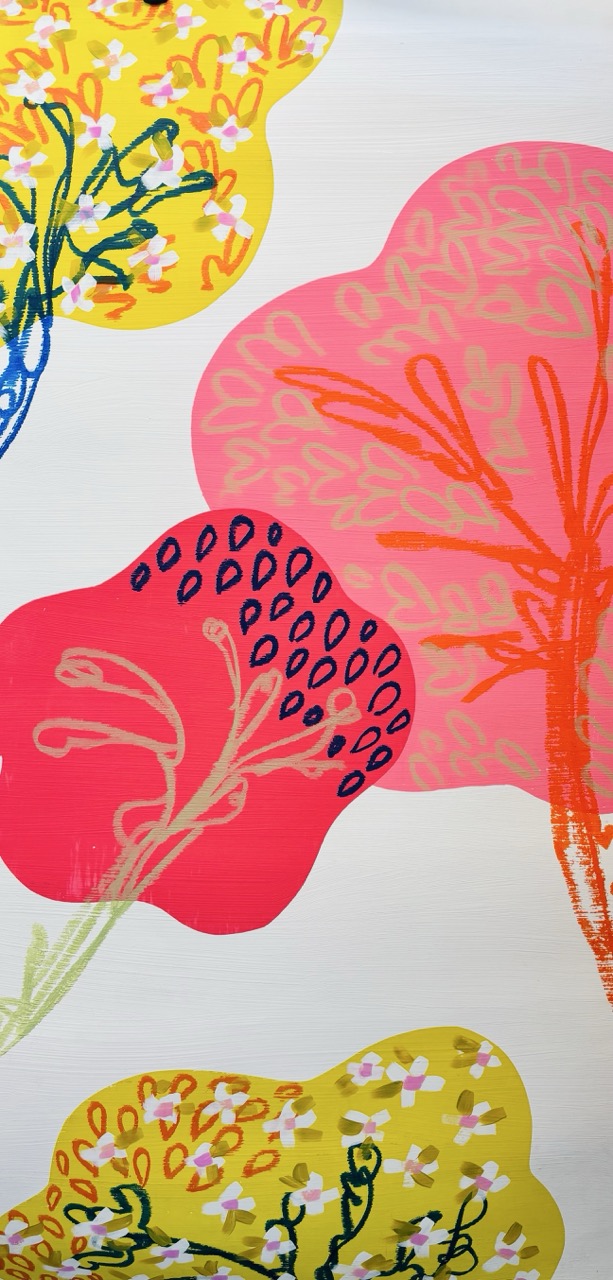 A vibrant abstract design featuring large, colourful flower shapes in pink, yellow, and green. The floral motifs are embellished with intricate patterns, set against a light background that enhances the bold colours.