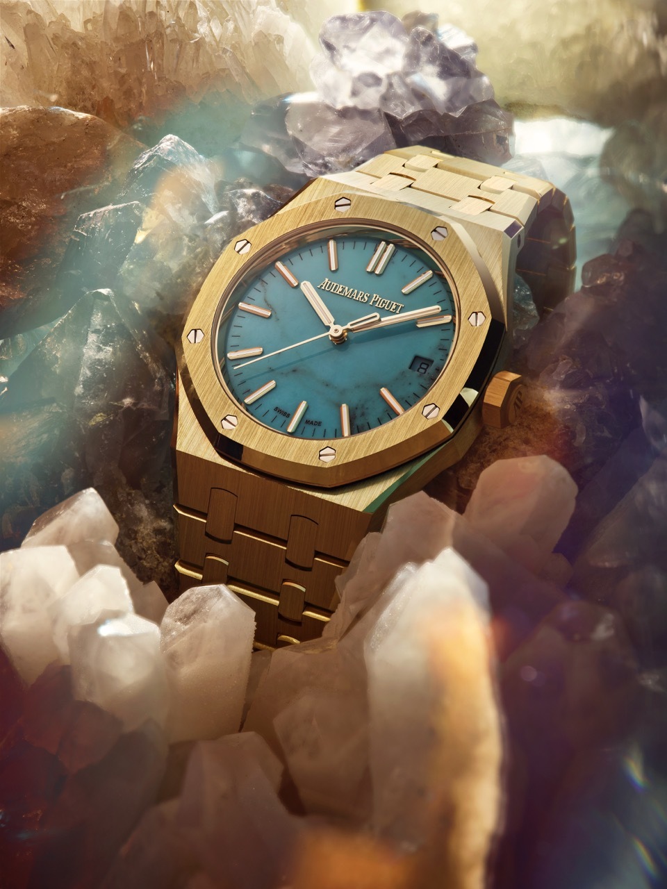 A golden watch on a crystalline background