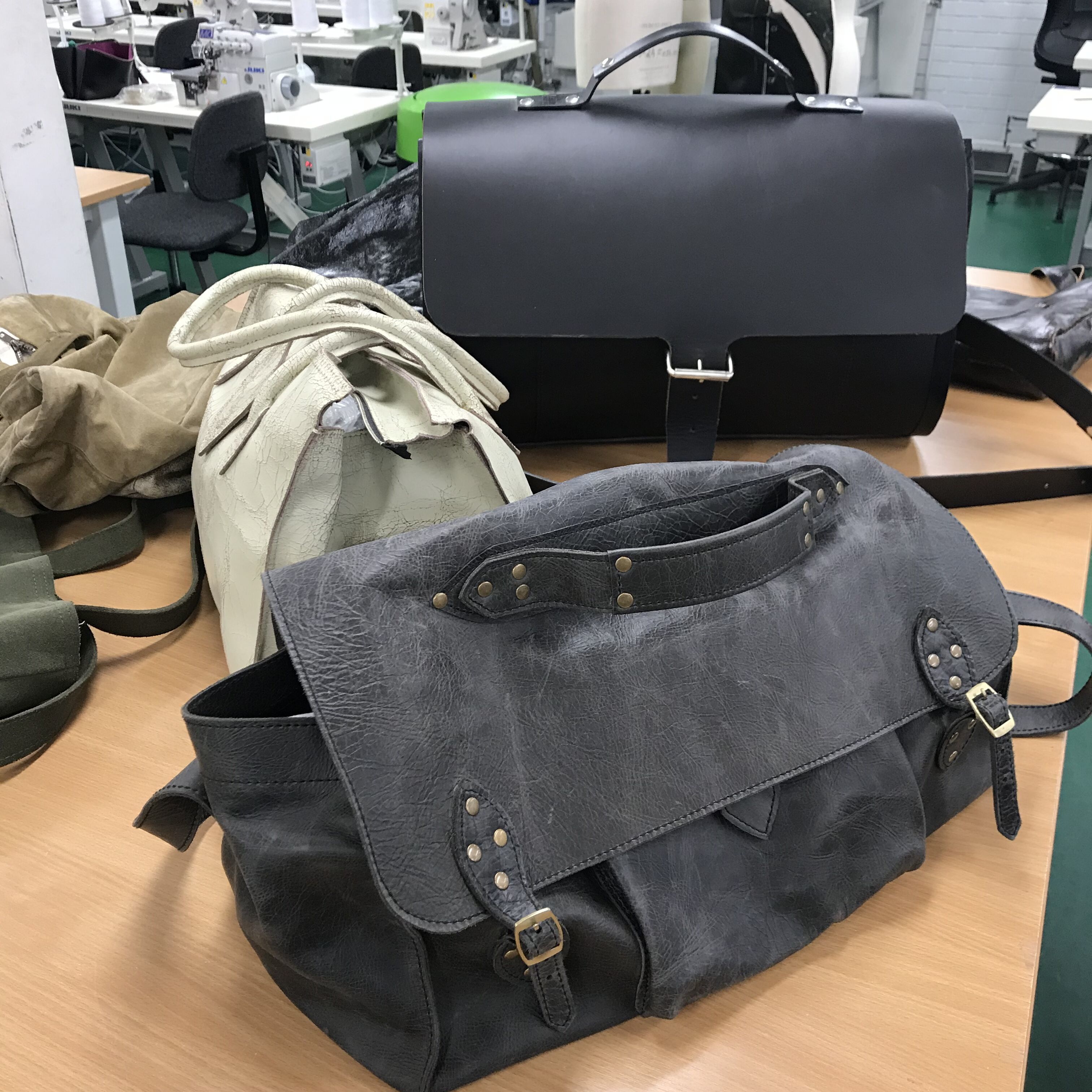 Three leather handbags