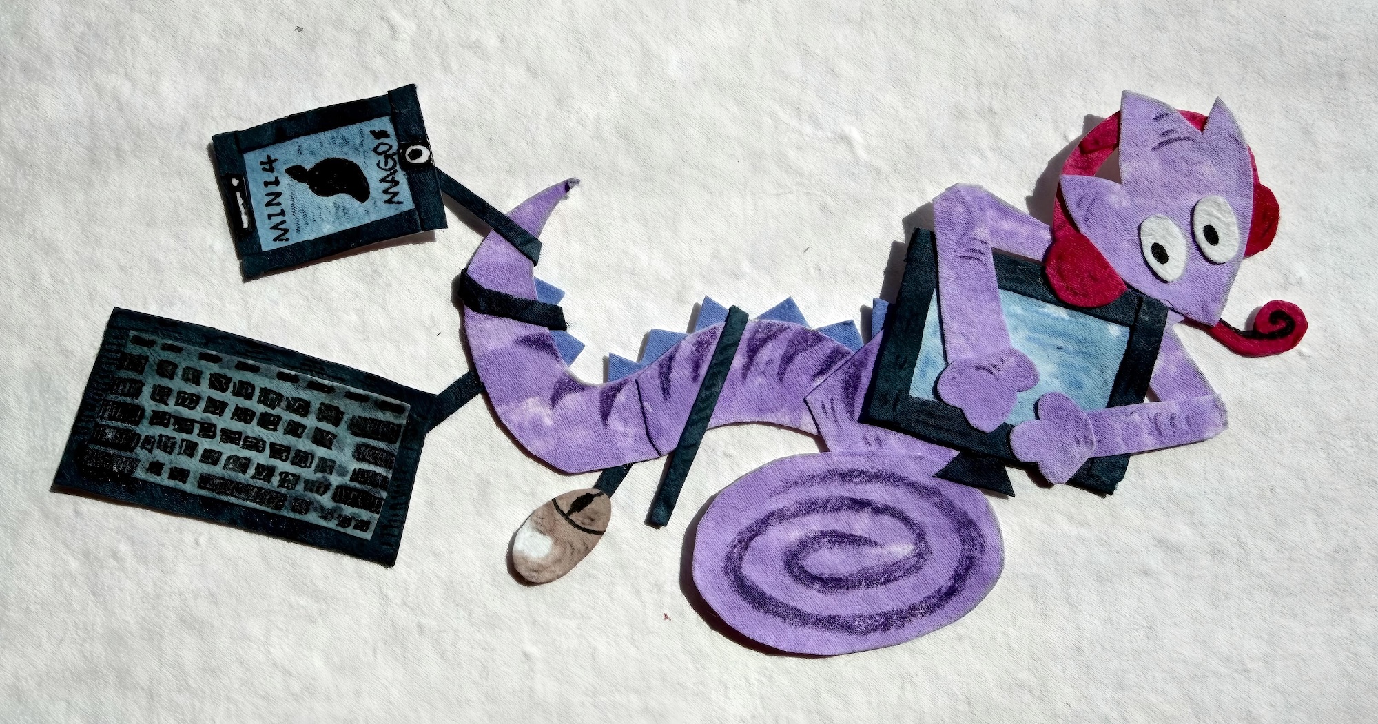 A purple cartoon cat-like character lies beside a black keyboard and a small card, illustrated on a white textured background.