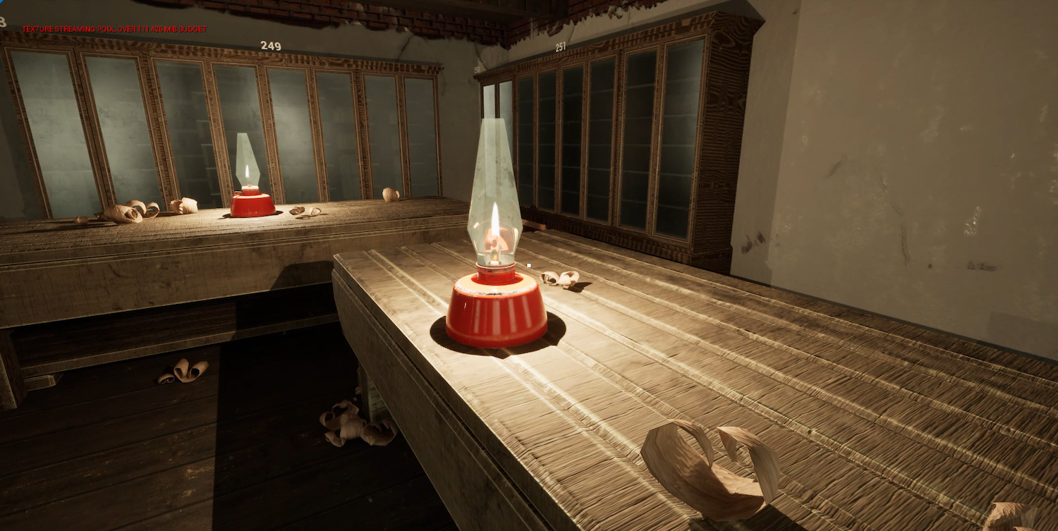 Industrial interior with concrete surfaces, metal railings, and white conical objects with red bases on tiled floor.